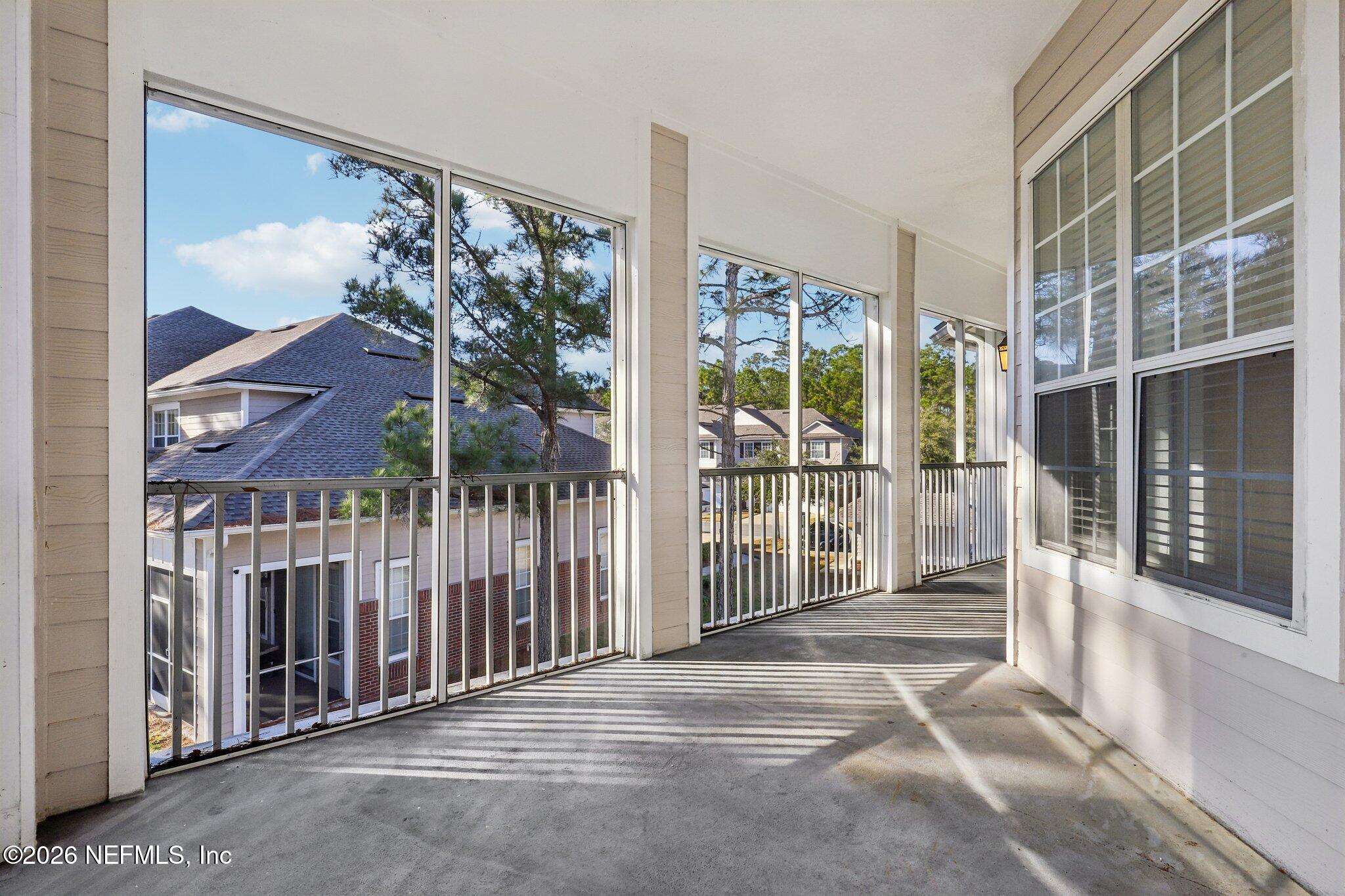 2035 Secret Garden Lane, Unit 505 Fleming Island, FL 32003 - Photo 31 of 47 a view of a city from a balcony