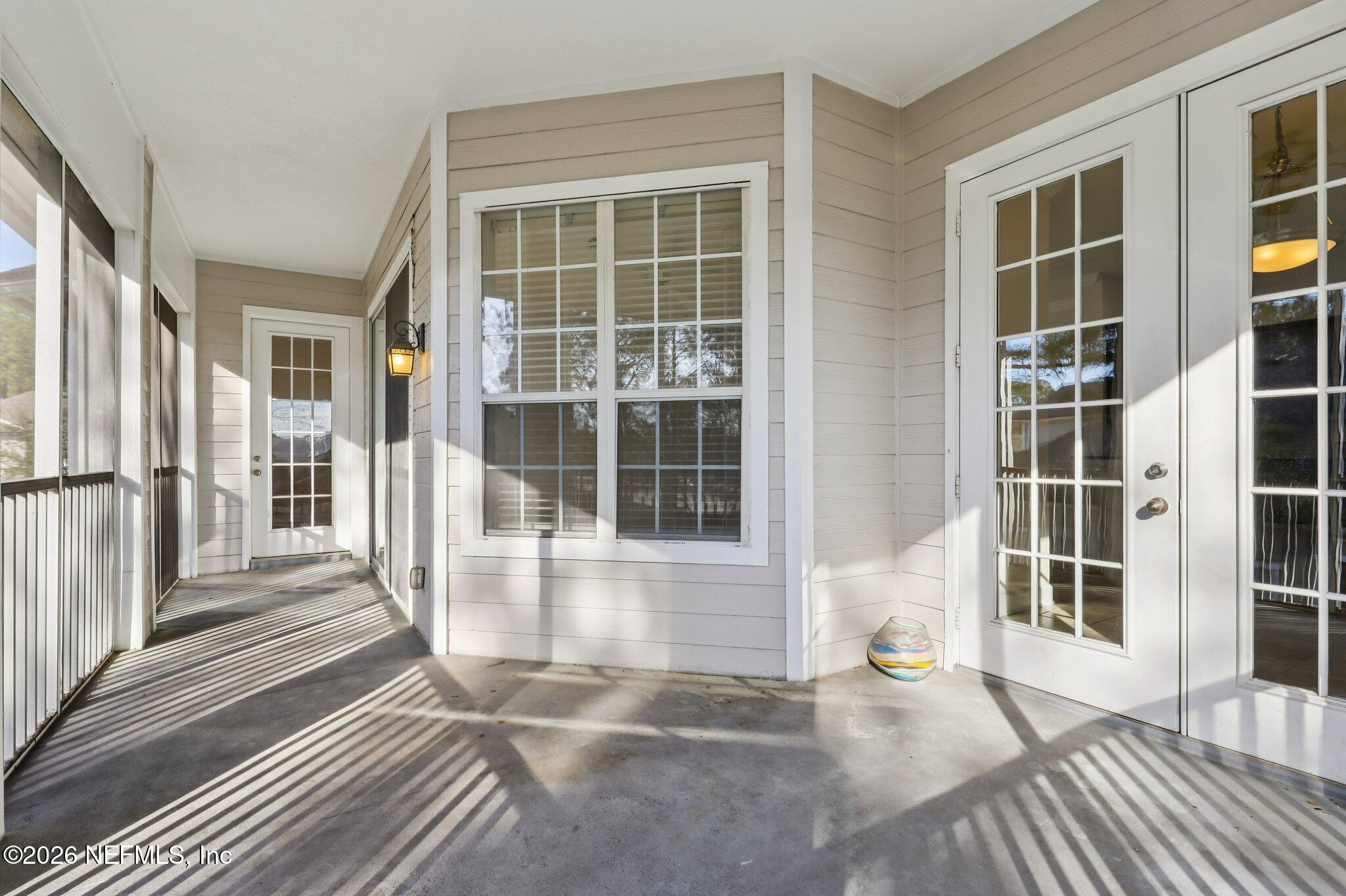 2035 Secret Garden Lane, Unit 505 Fleming Island, FL 32003 - Photo 32 of 47 a view of a balcony with a lounge chair