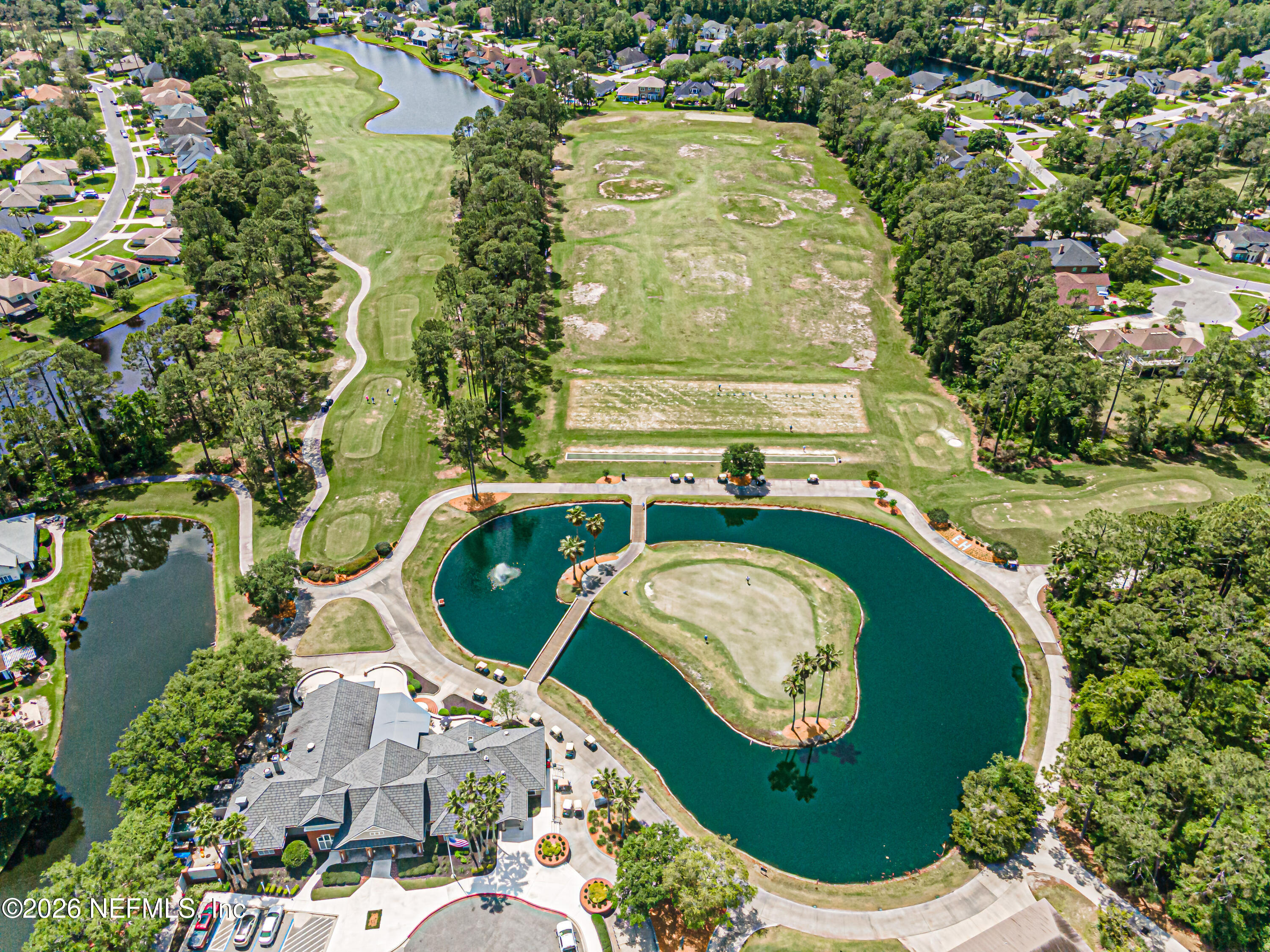 2035 Secret Garden Lane, Unit 505 Fleming Island, FL 32003 - Photo 37 of 47 an aerial view of a house with a swimming pool and outdoor space
