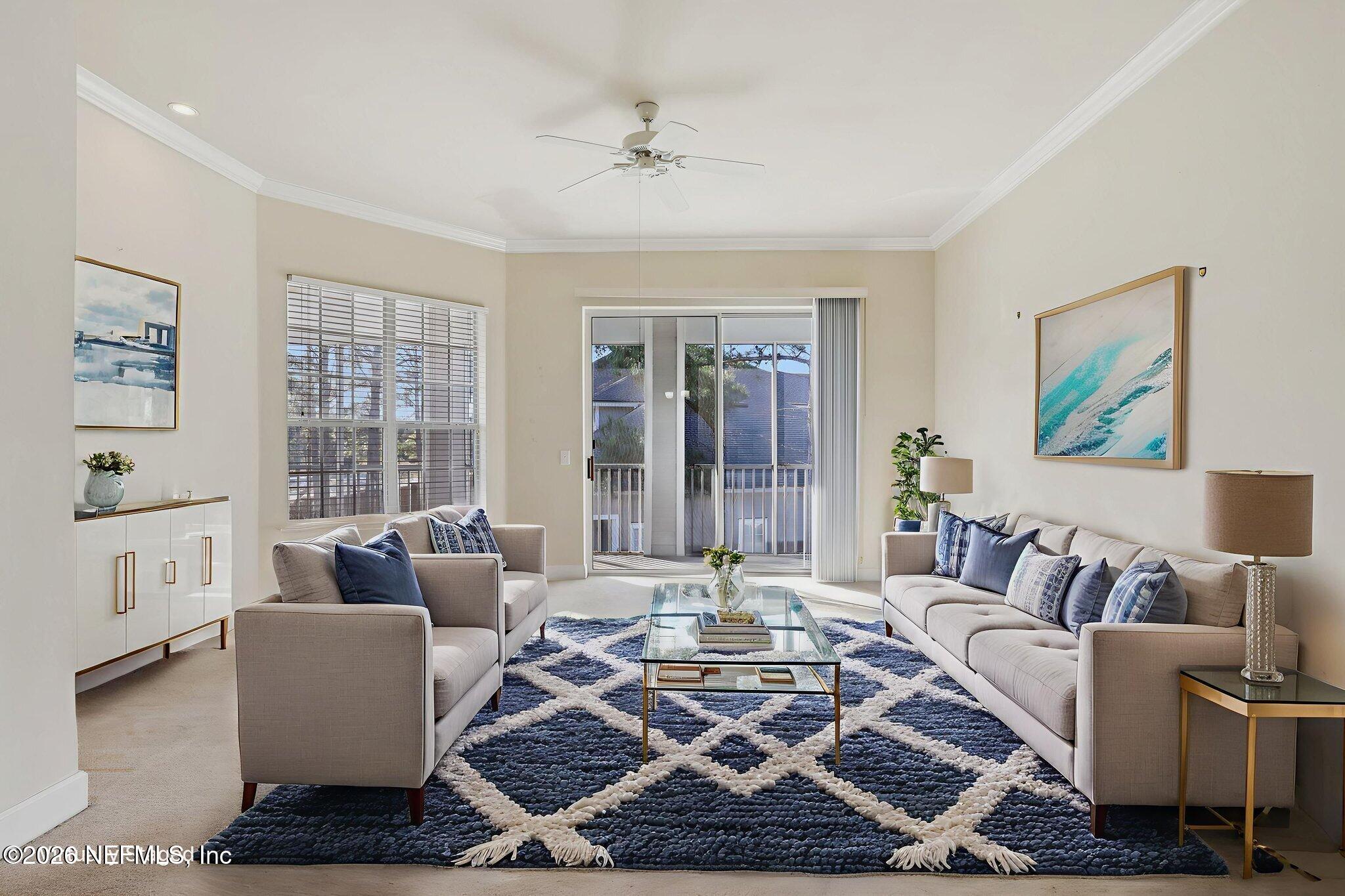 2035 Secret Garden Lane, Unit 505 Fleming Island, FL 32003 - Photo 10 of 47 a living room with furniture and a rug