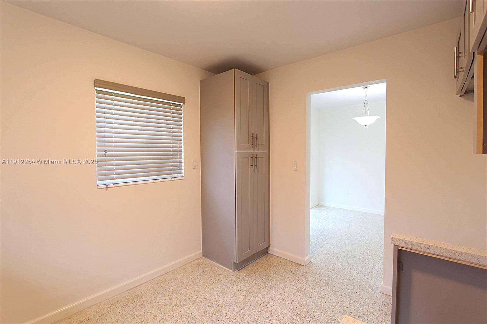 6203 Southwest 108th Place Miami, FL 33173 - Photo 11 of 23 a view of an empty room with a window