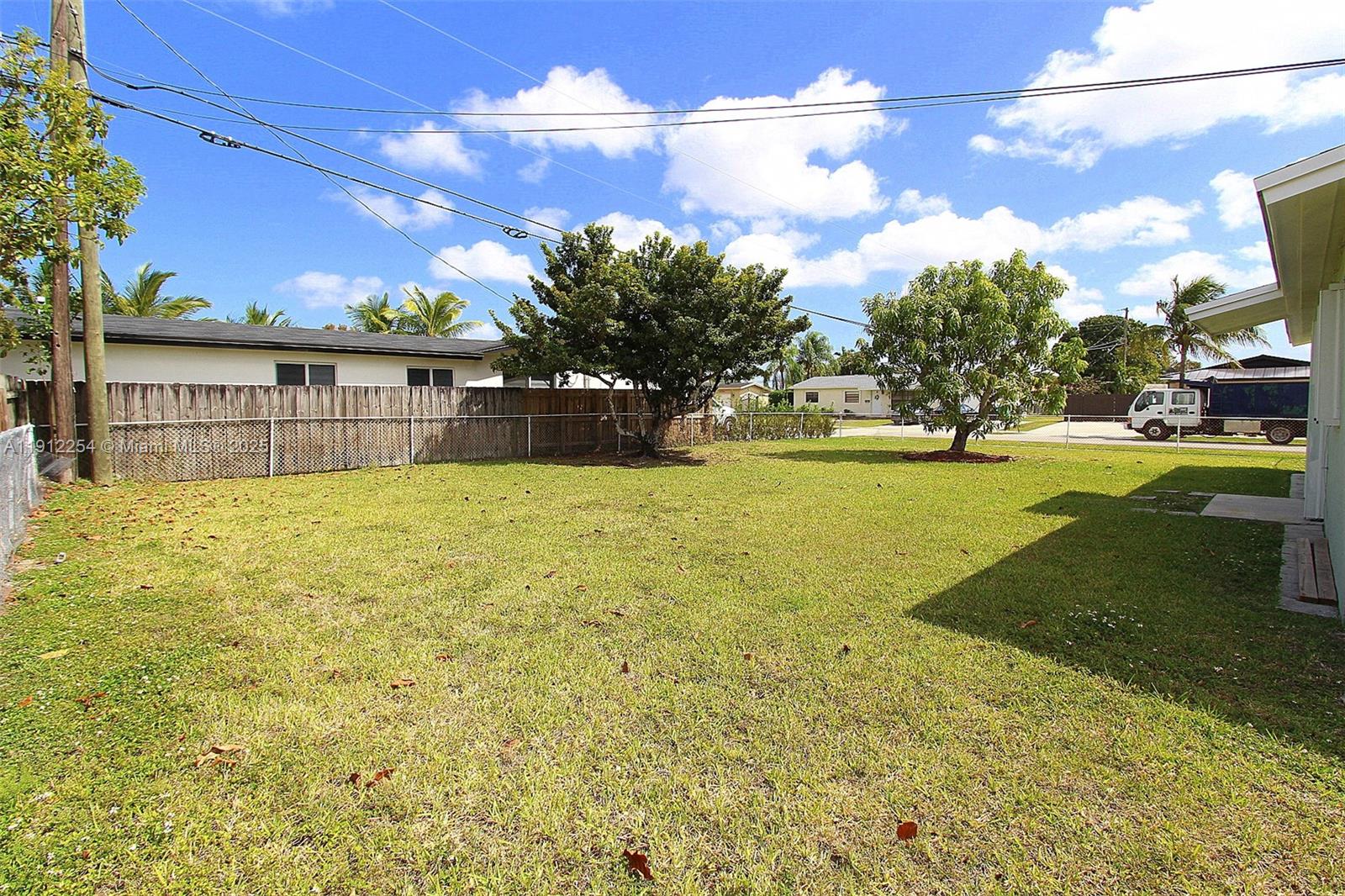 6203 Southwest 108th Place Miami, FL 33173 - Photo 20 of 23 a view of a house with a yard