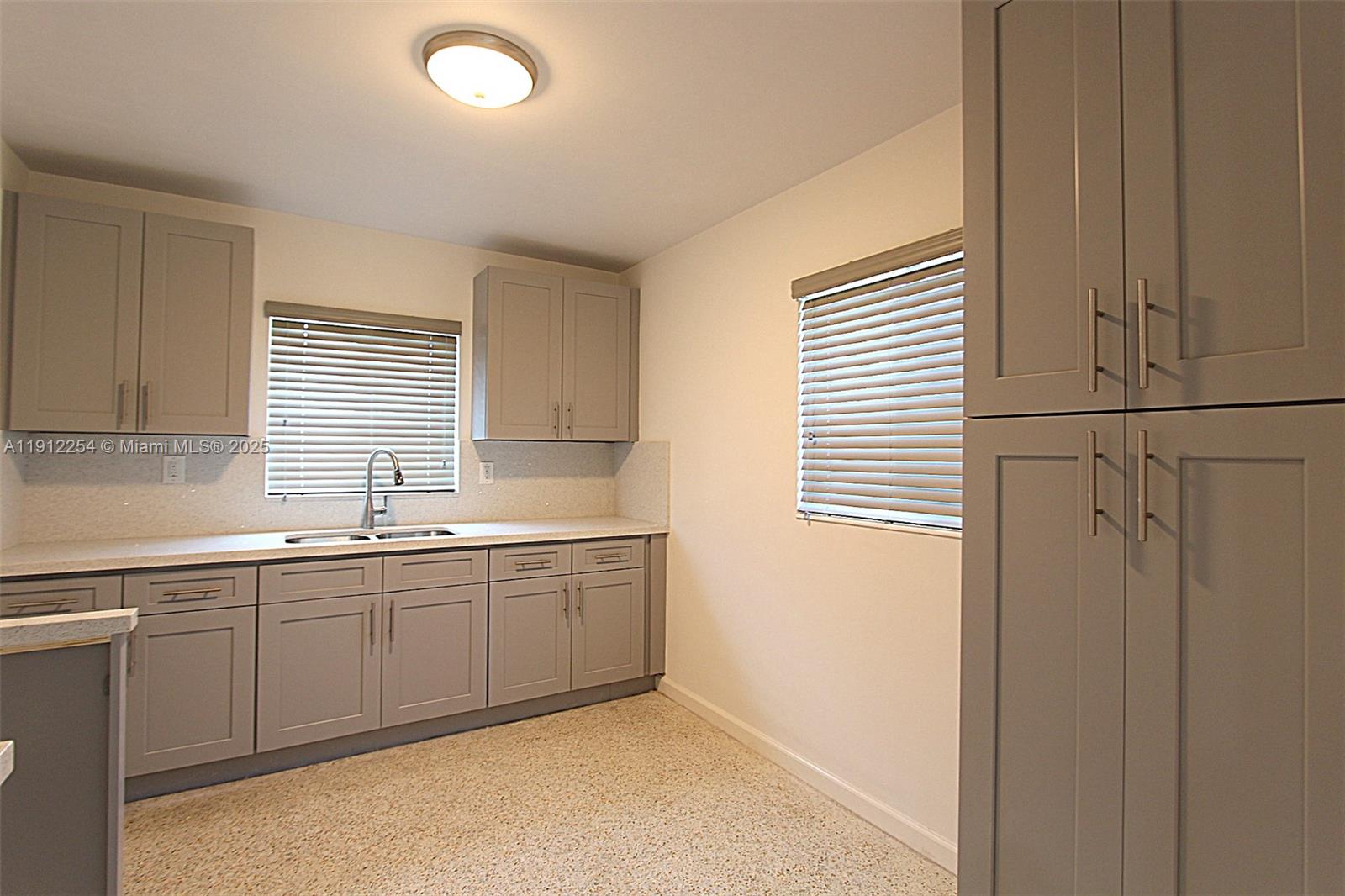 6203 Southwest 108th Place Miami, FL 33173 - Photo 9 of 23 a kitchen with sink and window