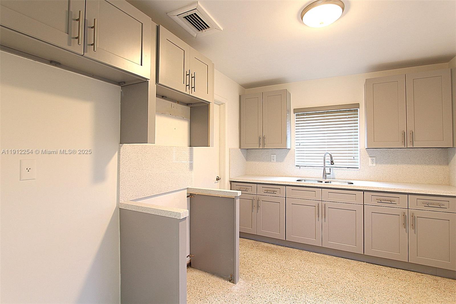 6203 Southwest 108th Place Miami, FL 33173 - Photo 10 of 23 a kitchen with a sink cabinets and window