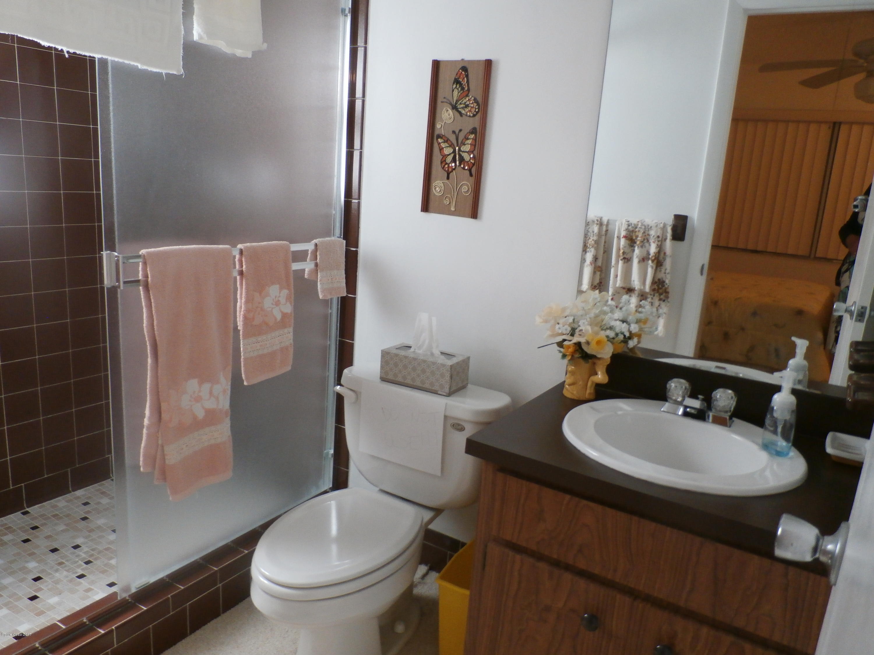 538 Trend Road West Melbourne, FL 32904 - Photo 12 of 16 a bathroom with a sink toilet and shower
