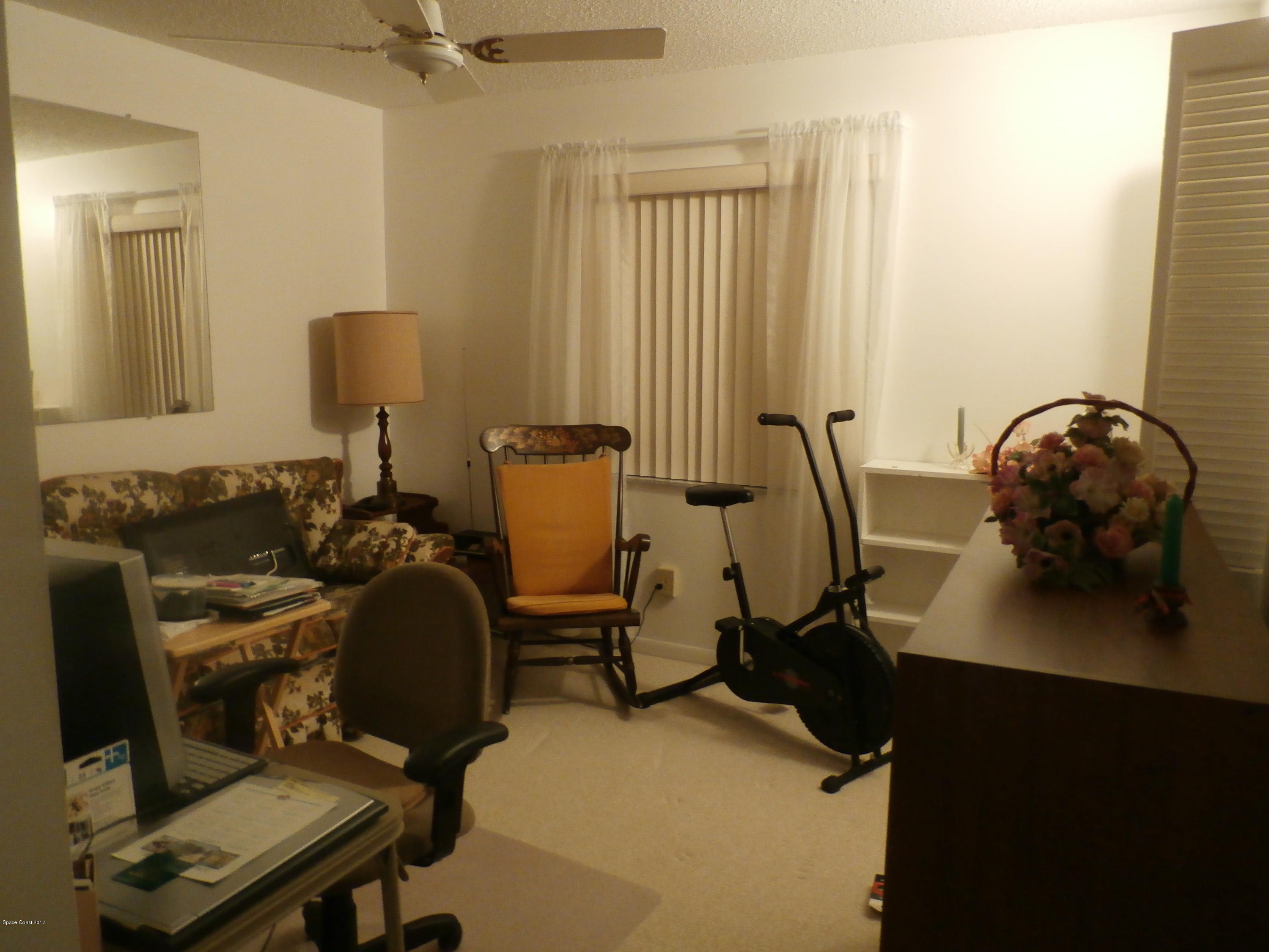 538 Trend Road West Melbourne, FL 32904 - Photo 15 of 16 a view of a workspace with furniture and a window