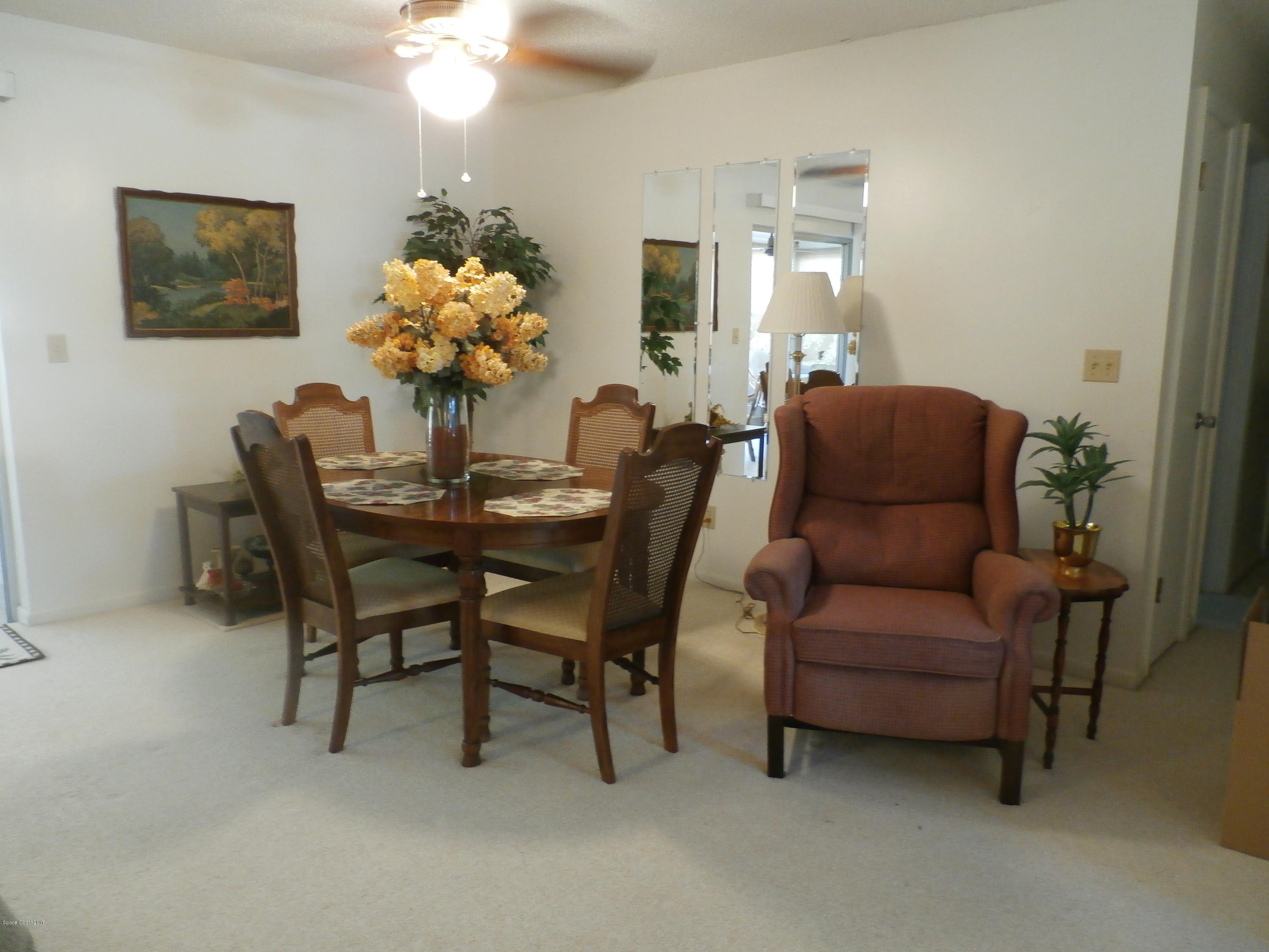 538 Trend Road West Melbourne, FL 32904 - Photo 5 of 16 a dining room with furniture and chandelier