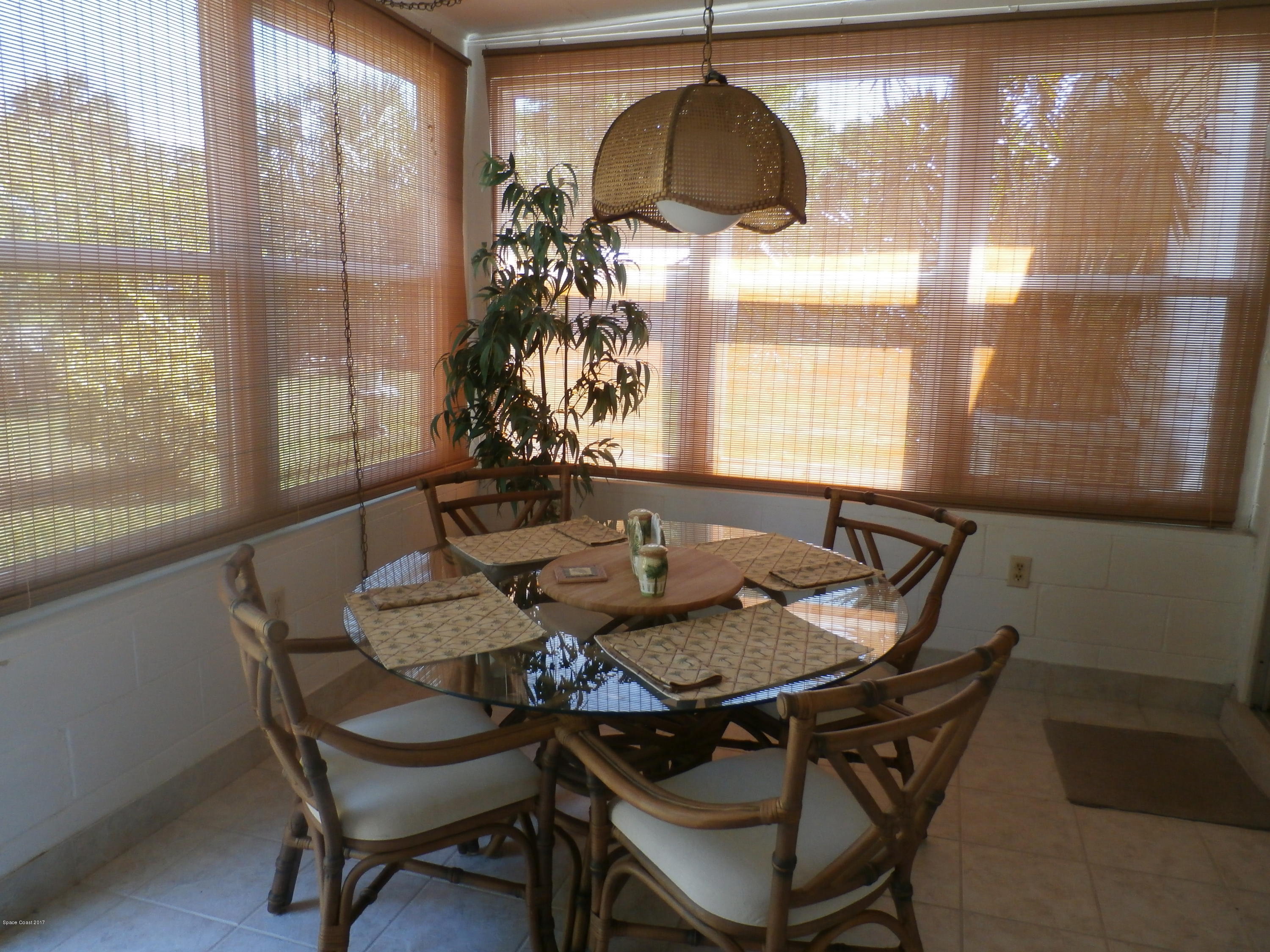 538 Trend Road West Melbourne, FL 32904 - Photo 10 of 16 a dining room with furniture a chandelier and wooden floor