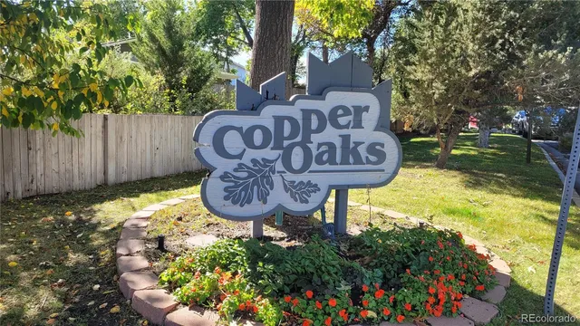 a view of a swimming pool with a chair and table