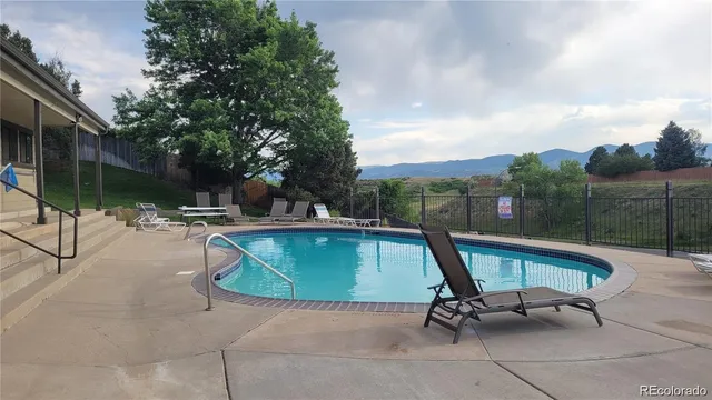 a view of a wooden bridge with lake