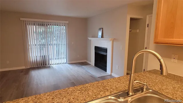 a view of a bedroom with wooden floor and entryway