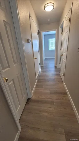 a view of a hallway view with staircase