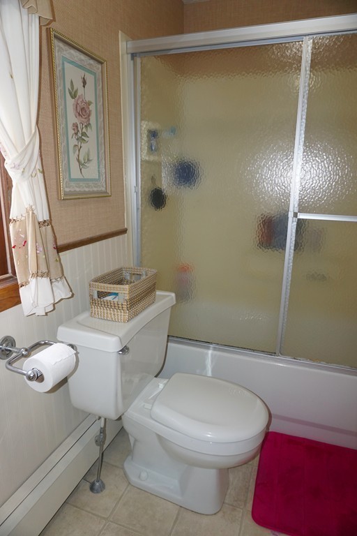 28 Lennon Street Gardner, MA 01440 - Photo 12 of 30 a white toilet sitting next to a bathroom sink