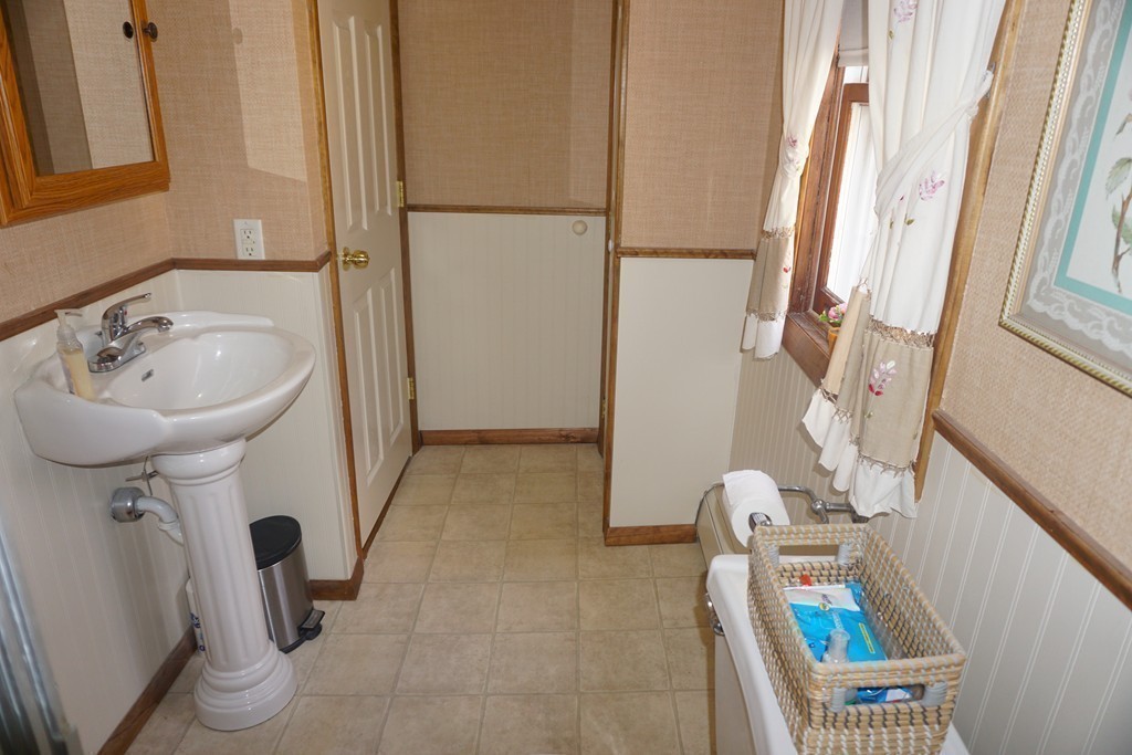 28 Lennon Street Gardner, MA 01440 - Photo 13 of 30 a bathroom with a sink toilet and shower