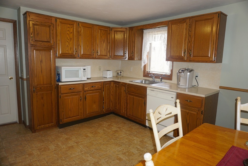 28 Lennon Street Gardner, MA 01440 - Photo 3 of 30 a kitchen with a sink cabinets and window