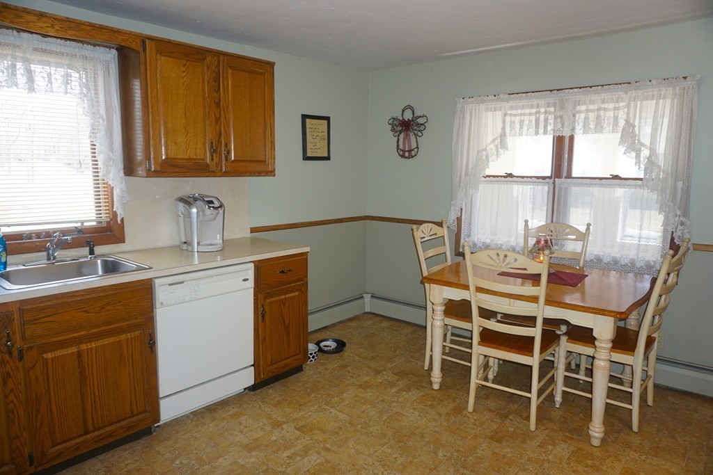28 Lennon Street Gardner, MA 01440 - Photo 5 of 30 a dining room with a window and chairs