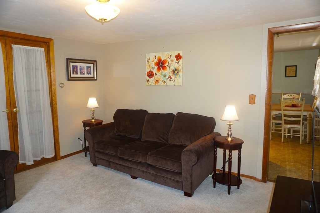 28 Lennon Street Gardner, MA 01440 - Photo 9 of 30 a living room with furniture and a flat screen tv
