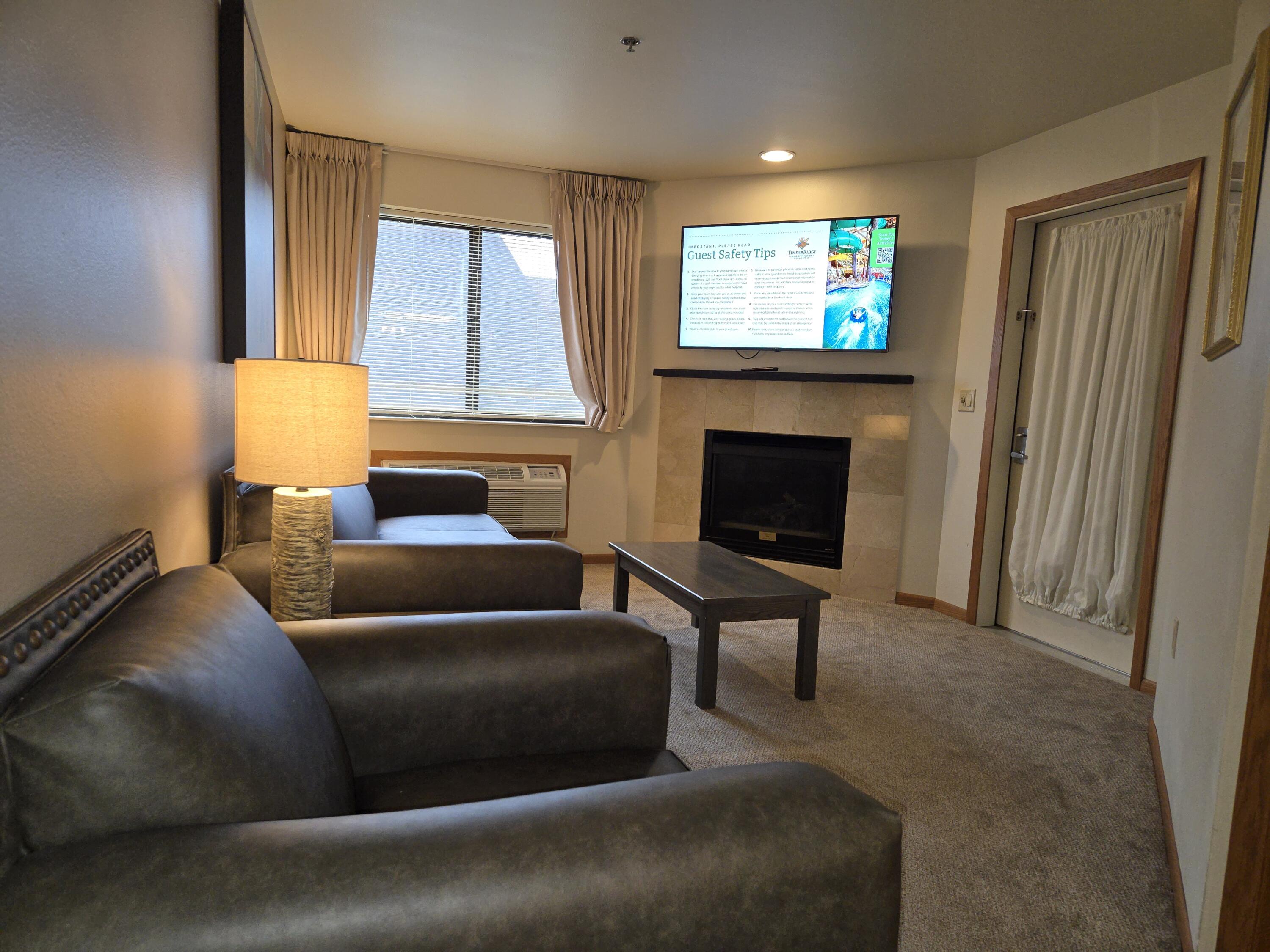 7020 Grand Geneva Way, Unit 361 Lyons, WI 53147 - Photo 11 of 29 Living Room with a Fireplace