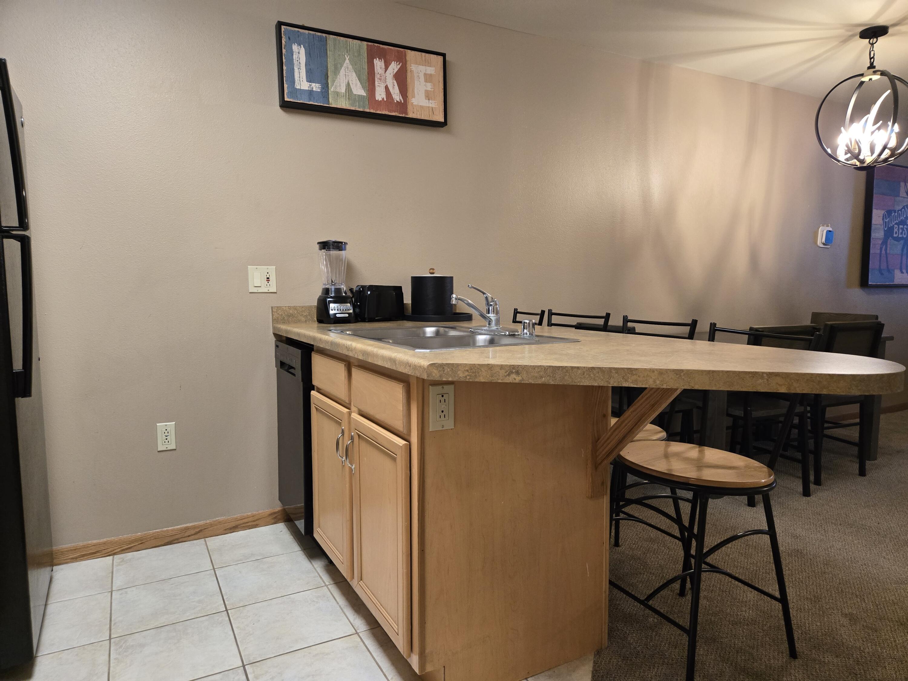 7020 Grand Geneva Way, Unit 361 Lyons, WI 53147 - Photo 17 of 29 Kitchen Peninsula