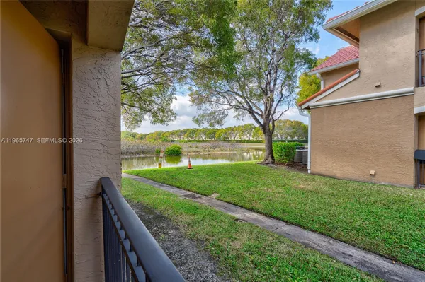 a view of a backyard with a garden and plants