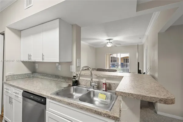 a kitchen with a sink and cabinets