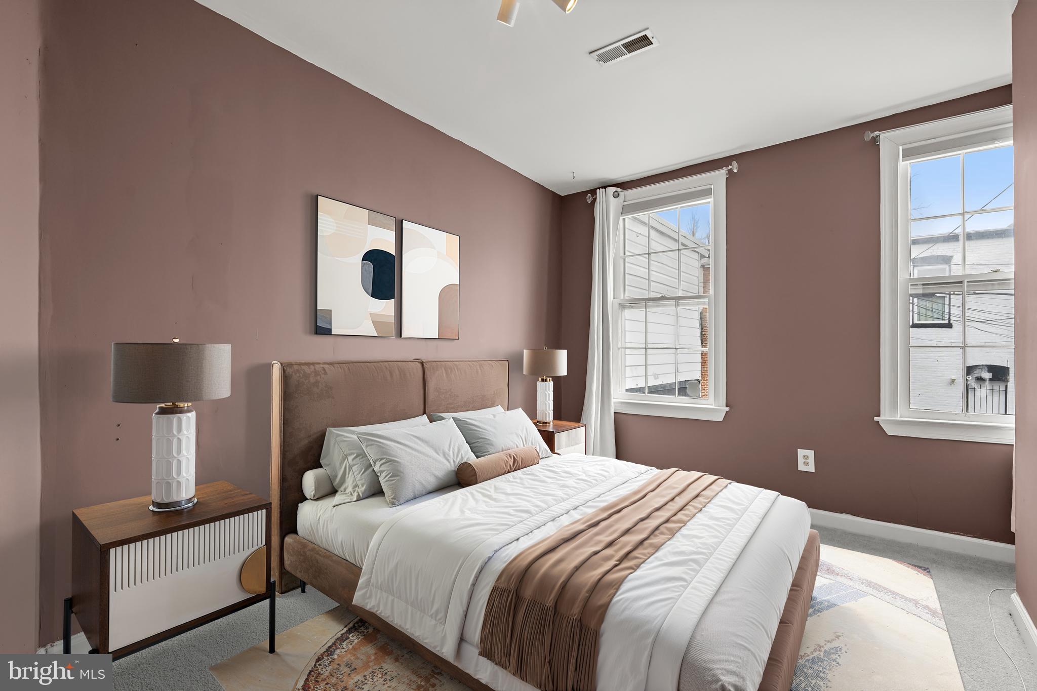 1648 Kramer Street Northeast Washington, DC 20002 - Photo 11 of 30 a bedroom with a bed and a window