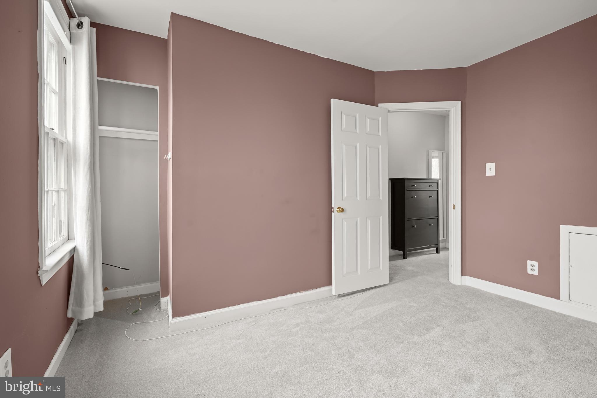 1648 Kramer Street Northeast Washington, DC 20002 - Photo 13 of 30 an empty room with closet and a window