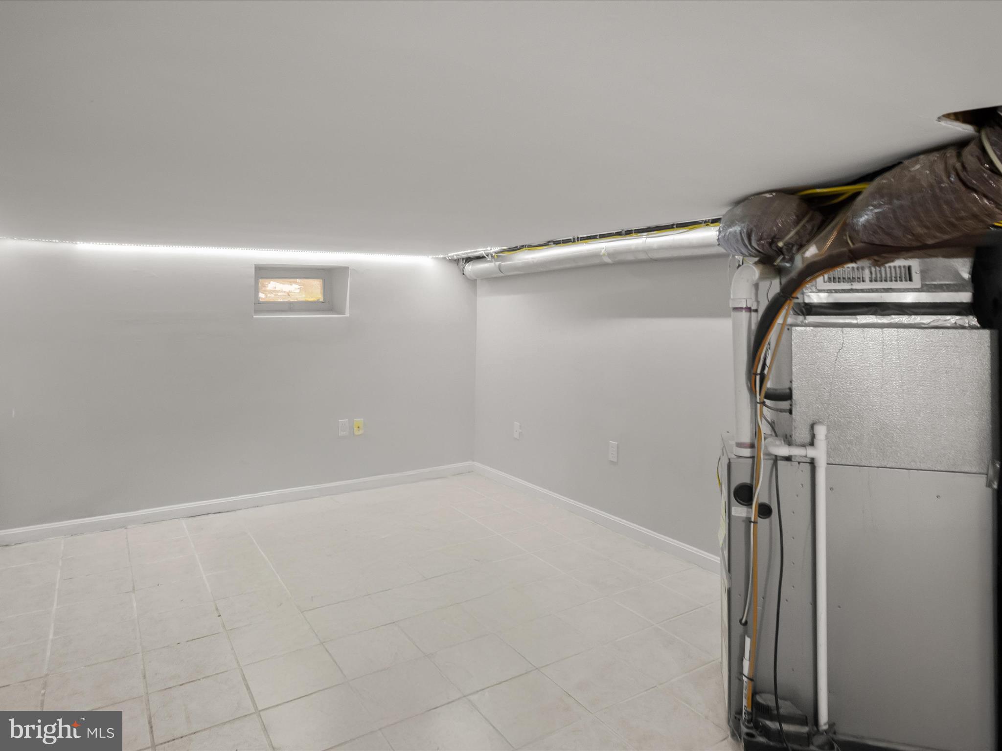 1648 Kramer Street Northeast Washington, DC 20002 - Photo 18 of 30 a view of a room with racks on the wall