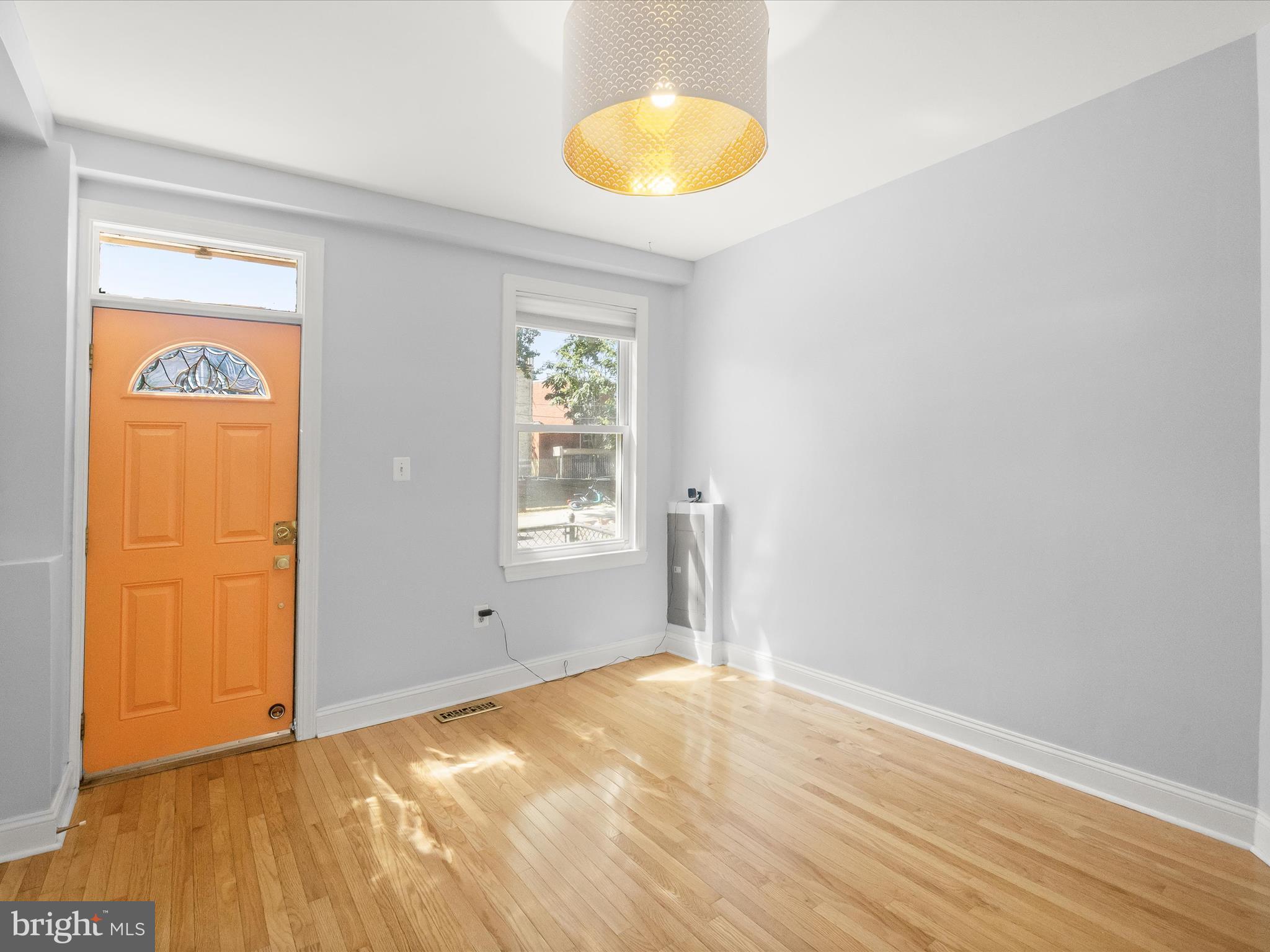 1648 Kramer Street Northeast Washington, DC 20002 - Photo 3 of 30 a view of empty room with wooden floor and fan