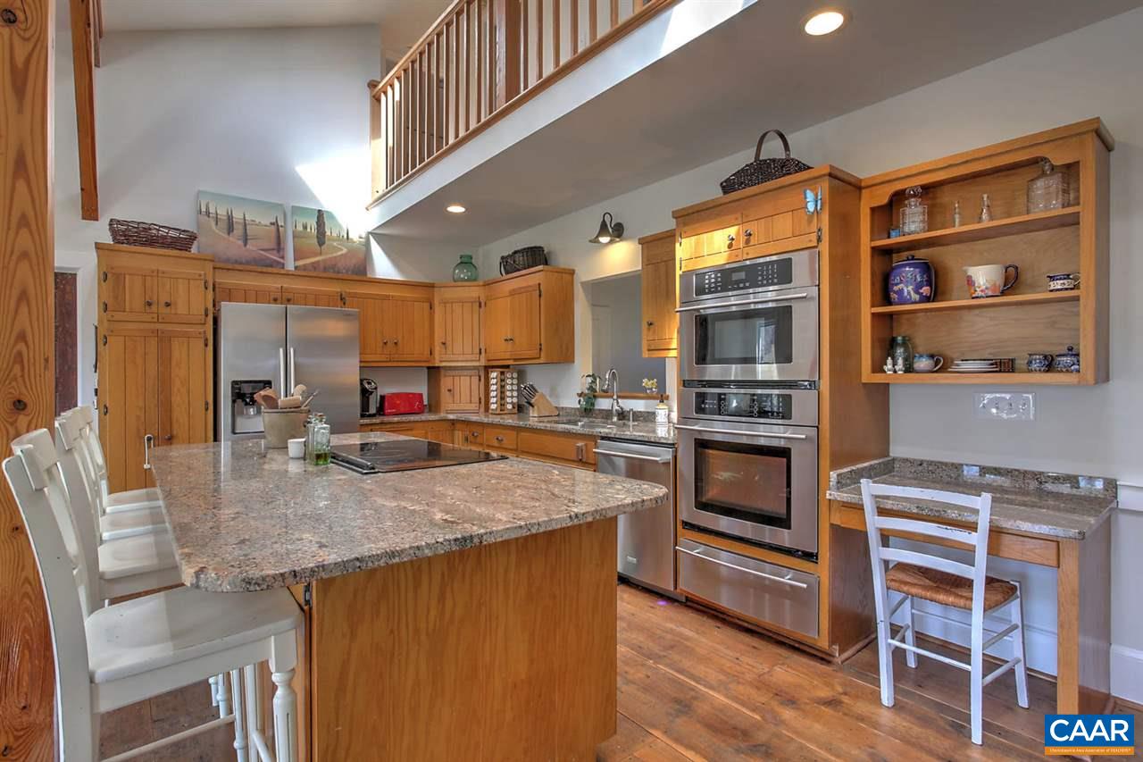 481 Beautiful Run Road Rochelle, VA 22738 - Photo 13 of 45 a kitchen with stainless steel appliances granite countertop a stove a sink and a refrigerator