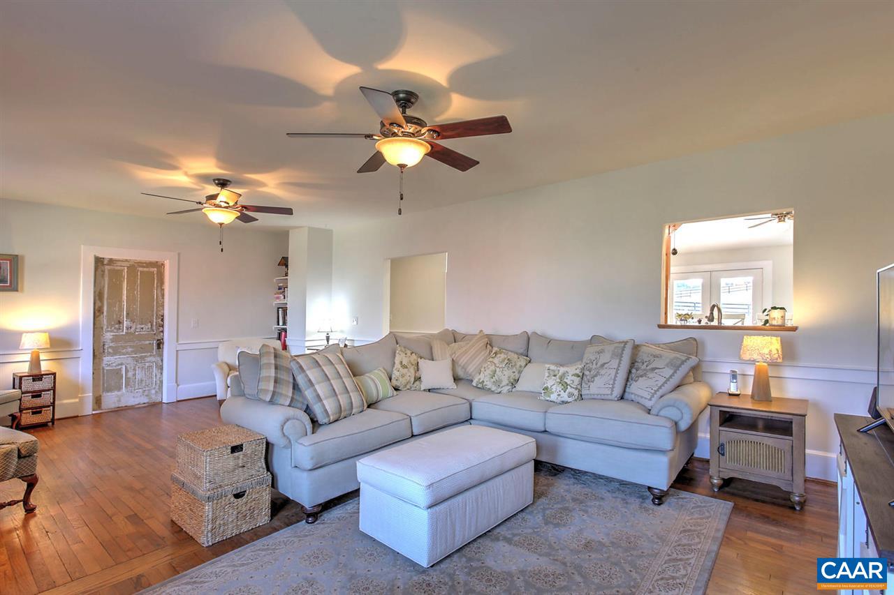 481 Beautiful Run Road Rochelle, VA 22738 - Photo 17 of 45 a living room with furniture and a chandelier