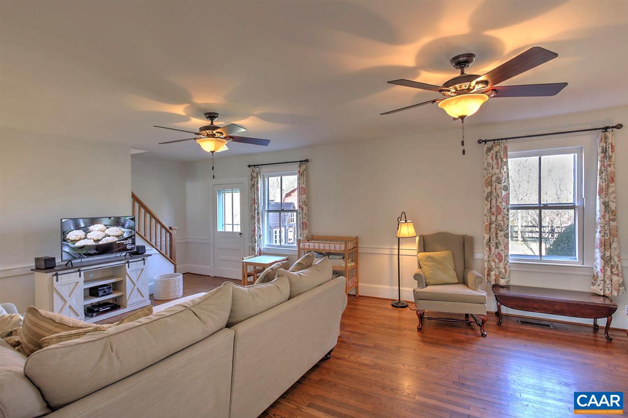 481 Beautiful Run Road Rochelle, VA 22738 - Photo 18 of 45 a living room with furniture and a chandelier