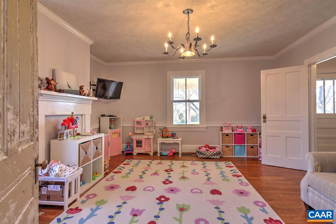 481 Beautiful Run Road Rochelle, VA 22738 - Photo 21 of 45 a bed room with a bed furniture and a chandelier