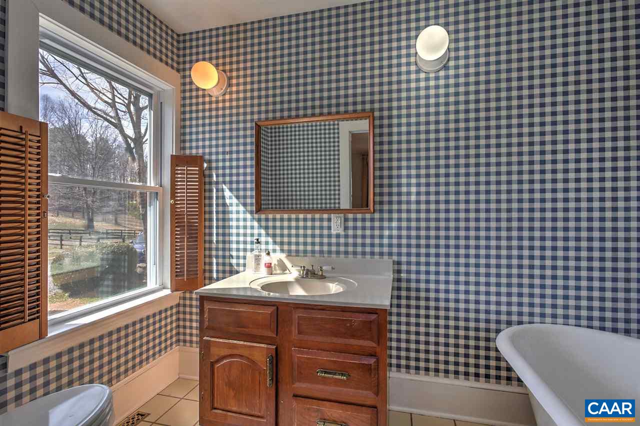 481 Beautiful Run Road Rochelle, VA 22738 - Photo 24 of 45 a bathroom with a sink and a mirror