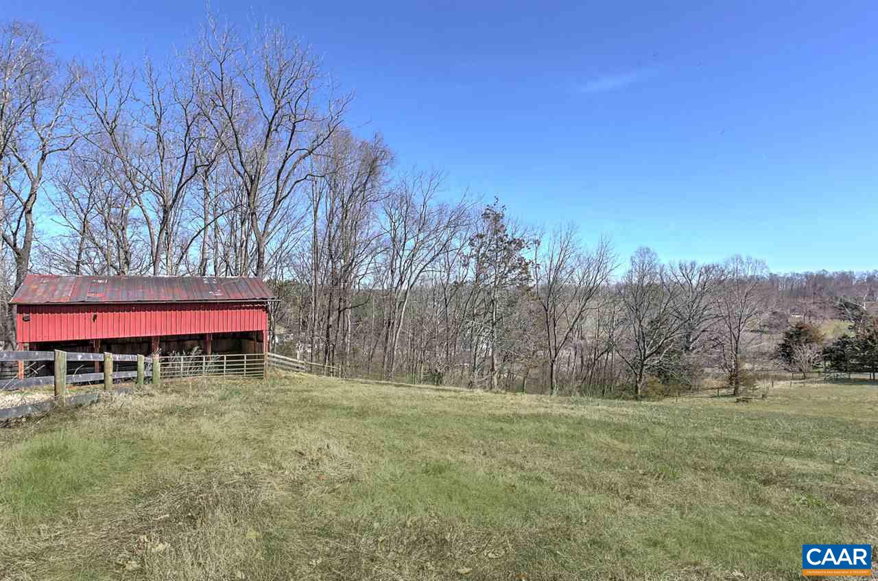 481 Beautiful Run Road Rochelle, VA 22738 - Photo 36 of 45 a table and chairs sitting in the middle of a field