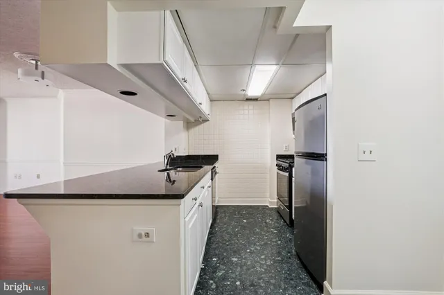 a hallway with cabinets