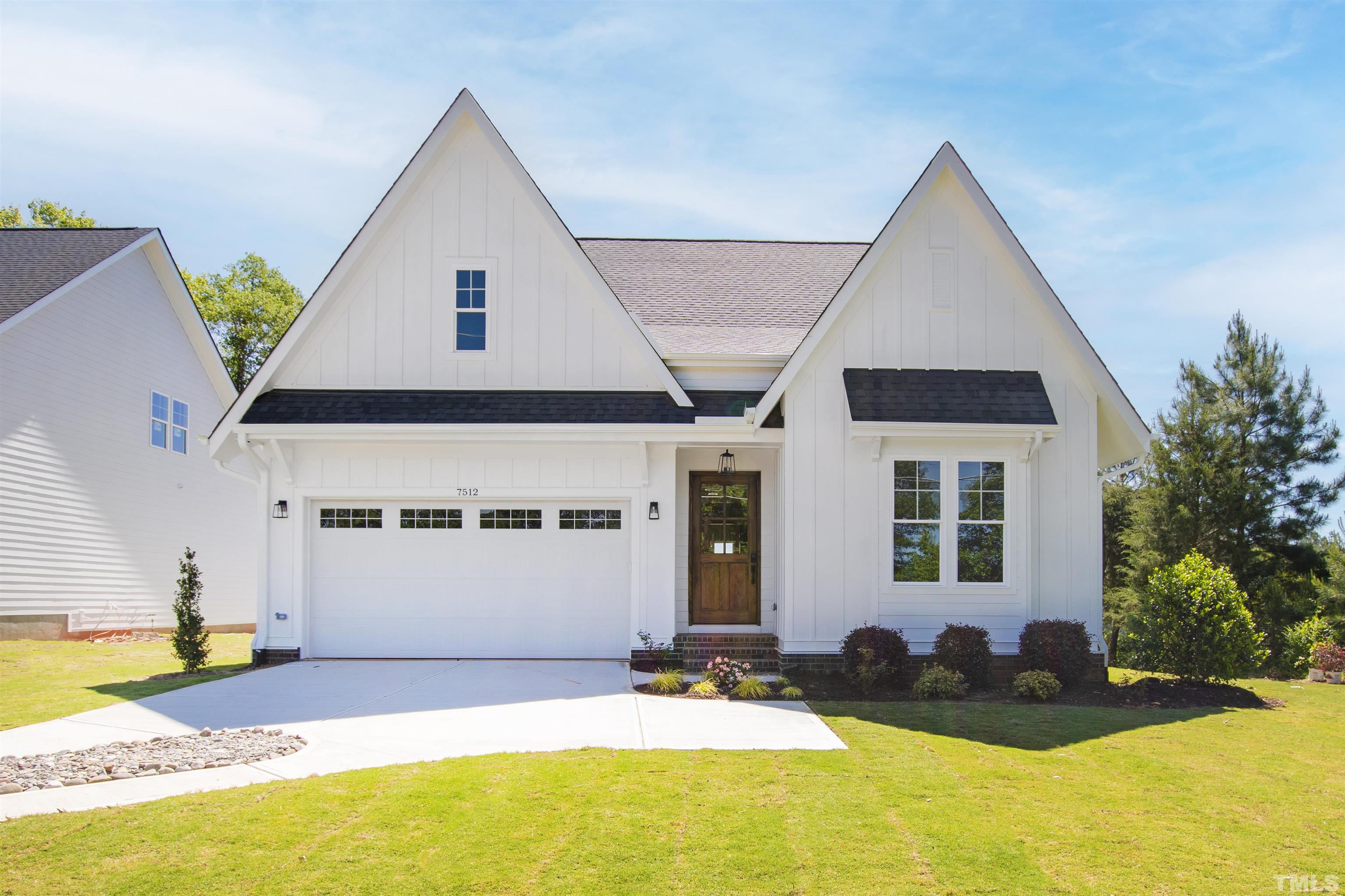 7528 Pinecrest Road Raleigh, NC 27613 - Photo 1 of 45 a front view of a house with swimming pool