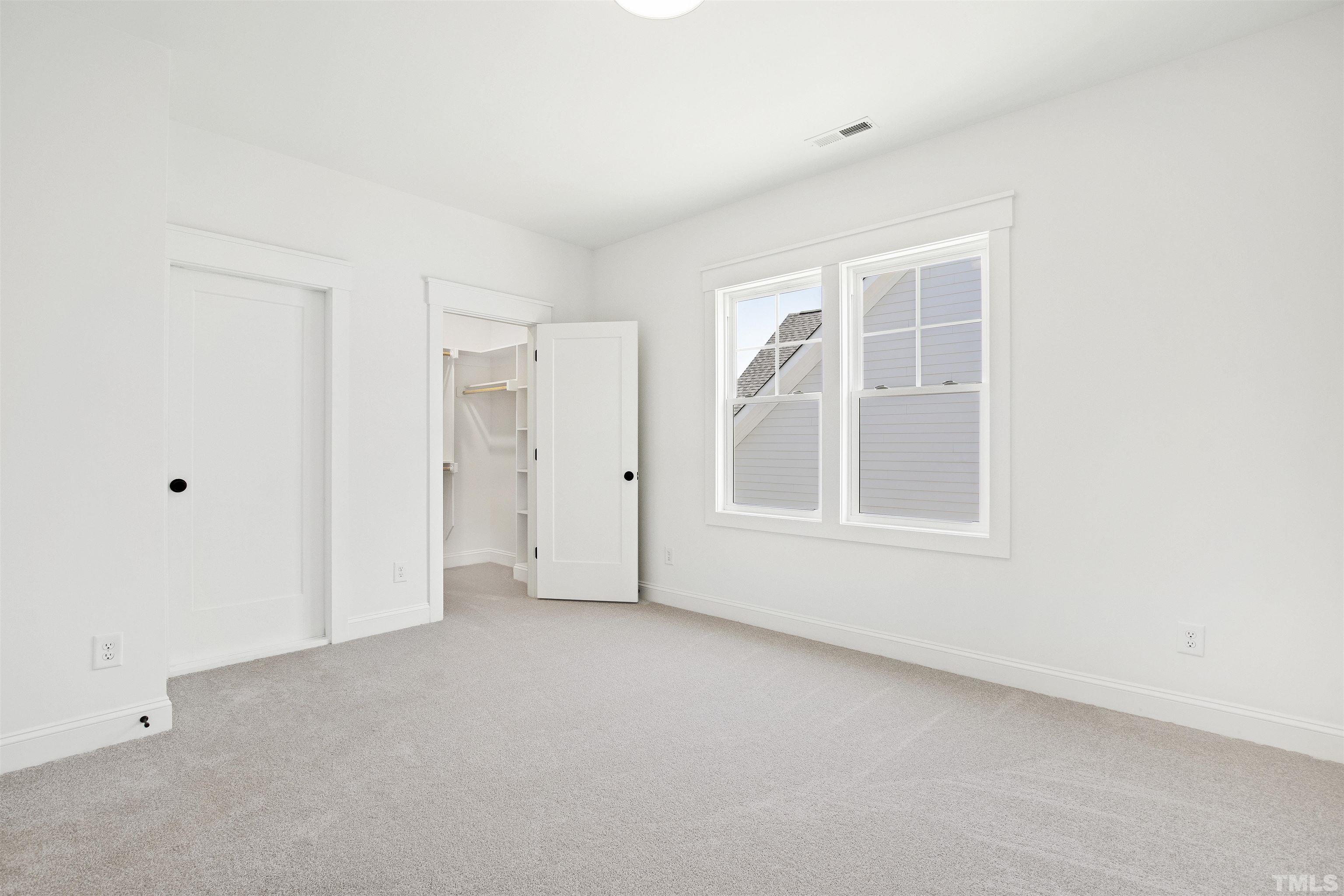 7528 Pinecrest Road Raleigh, NC 27613 - Photo 32 of 45 a view of an empty room with a window
