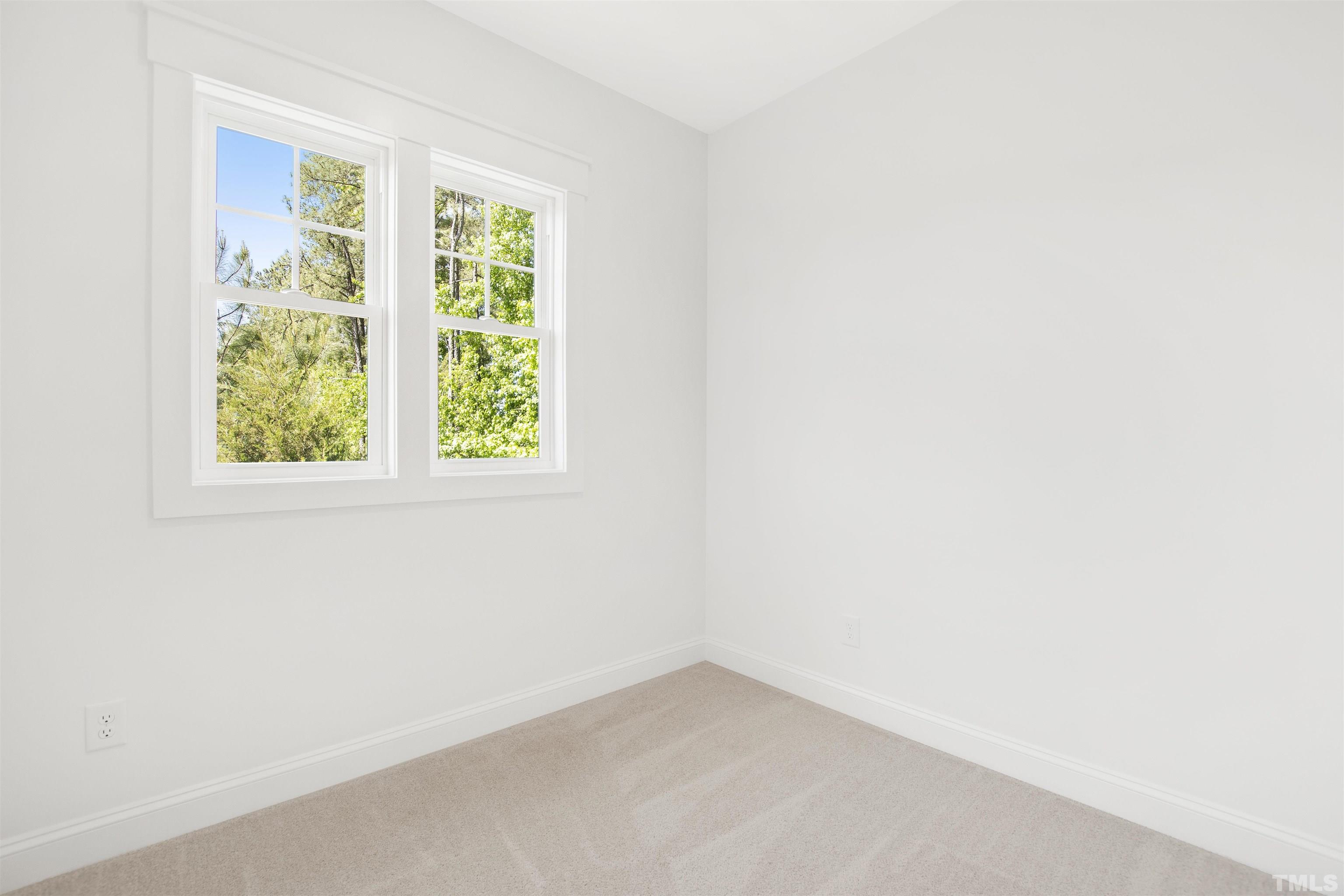 7528 Pinecrest Road Raleigh, NC 27613 - Photo 35 of 45 an empty room with a window