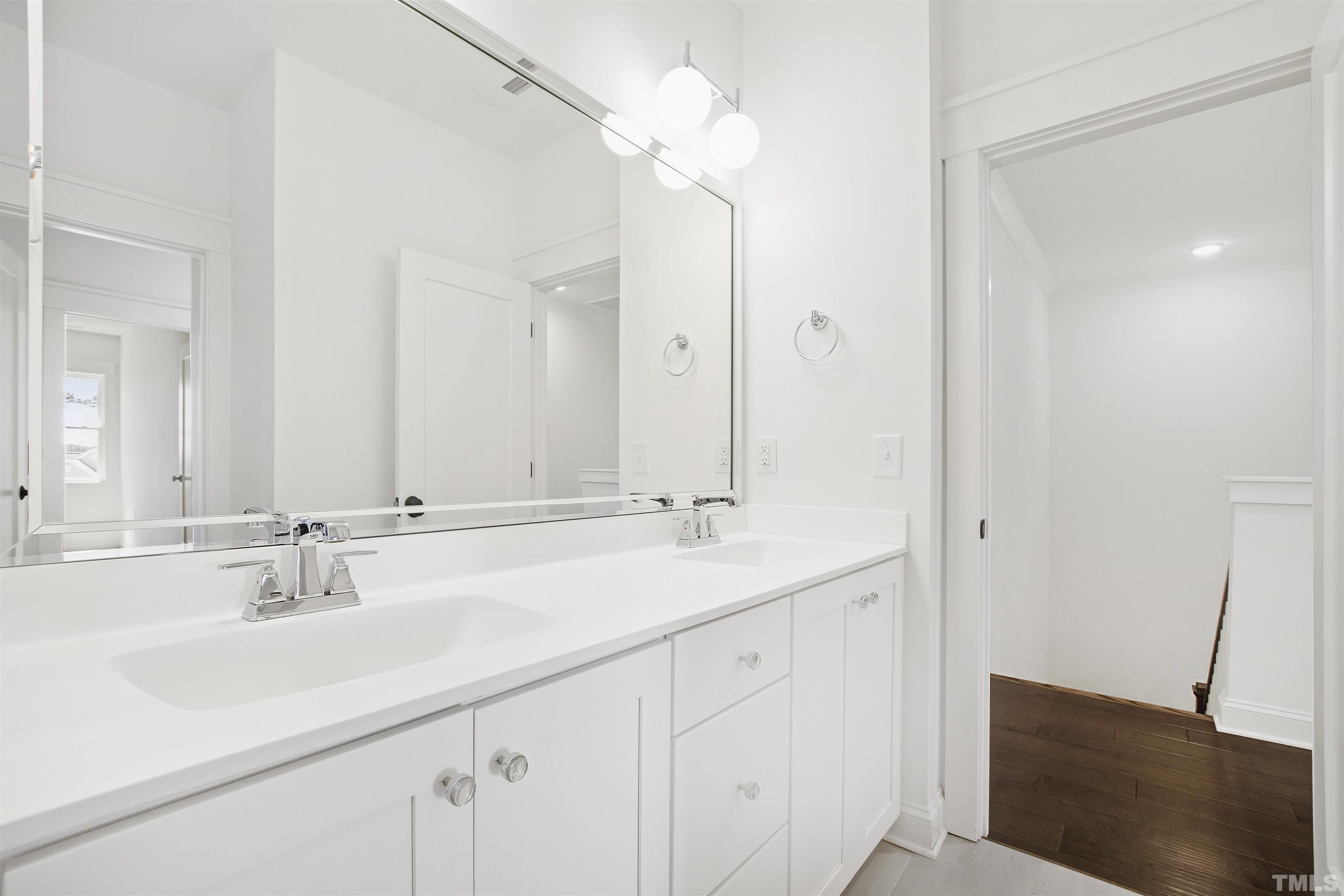 7528 Pinecrest Road Raleigh, NC 27613 - Photo 38 of 45 a bathroom with a sink and a mirror