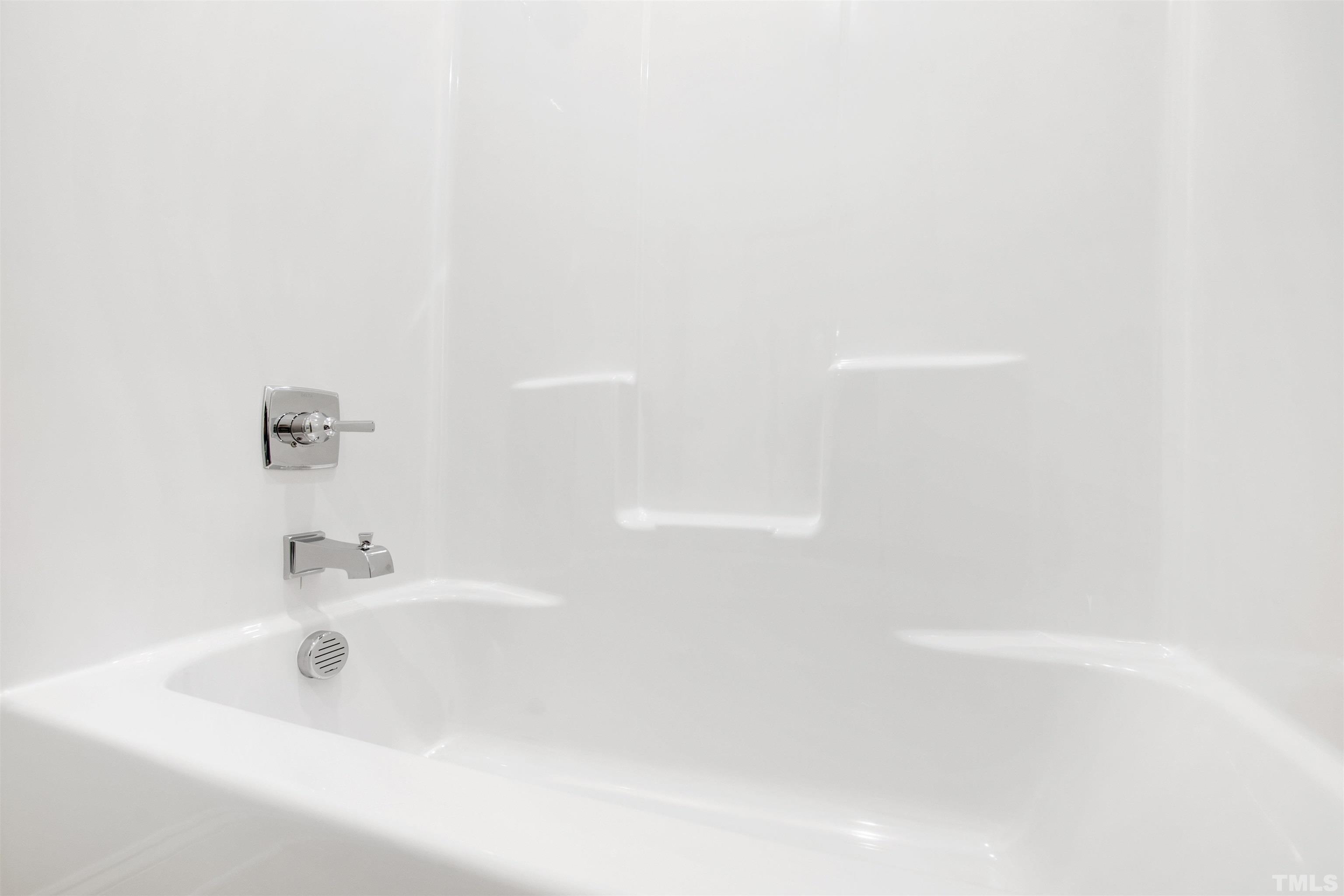 7528 Pinecrest Road Raleigh, NC 27613 - Photo 39 of 45 a close up of a bathtub
