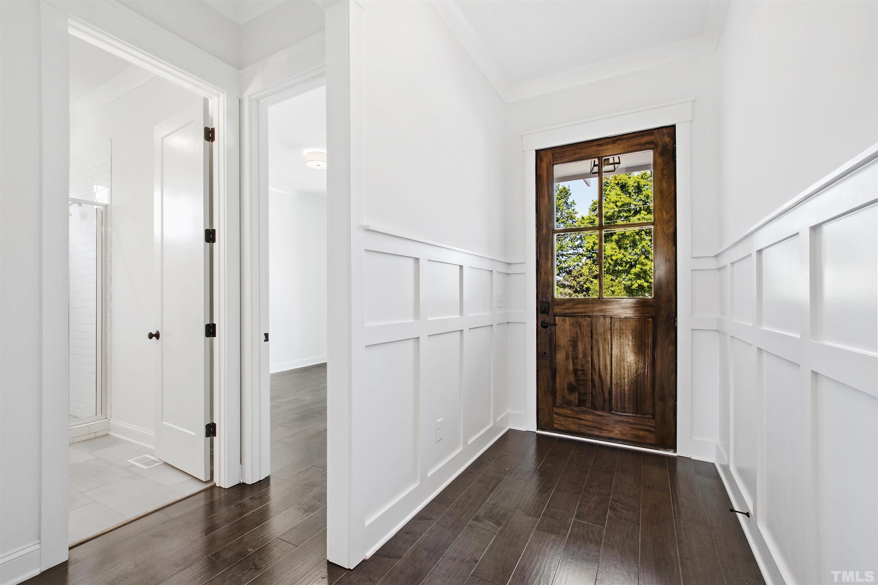 7528 Pinecrest Road Raleigh, NC 27613 - Photo 4 of 45 a view of an entryway with wooden floor