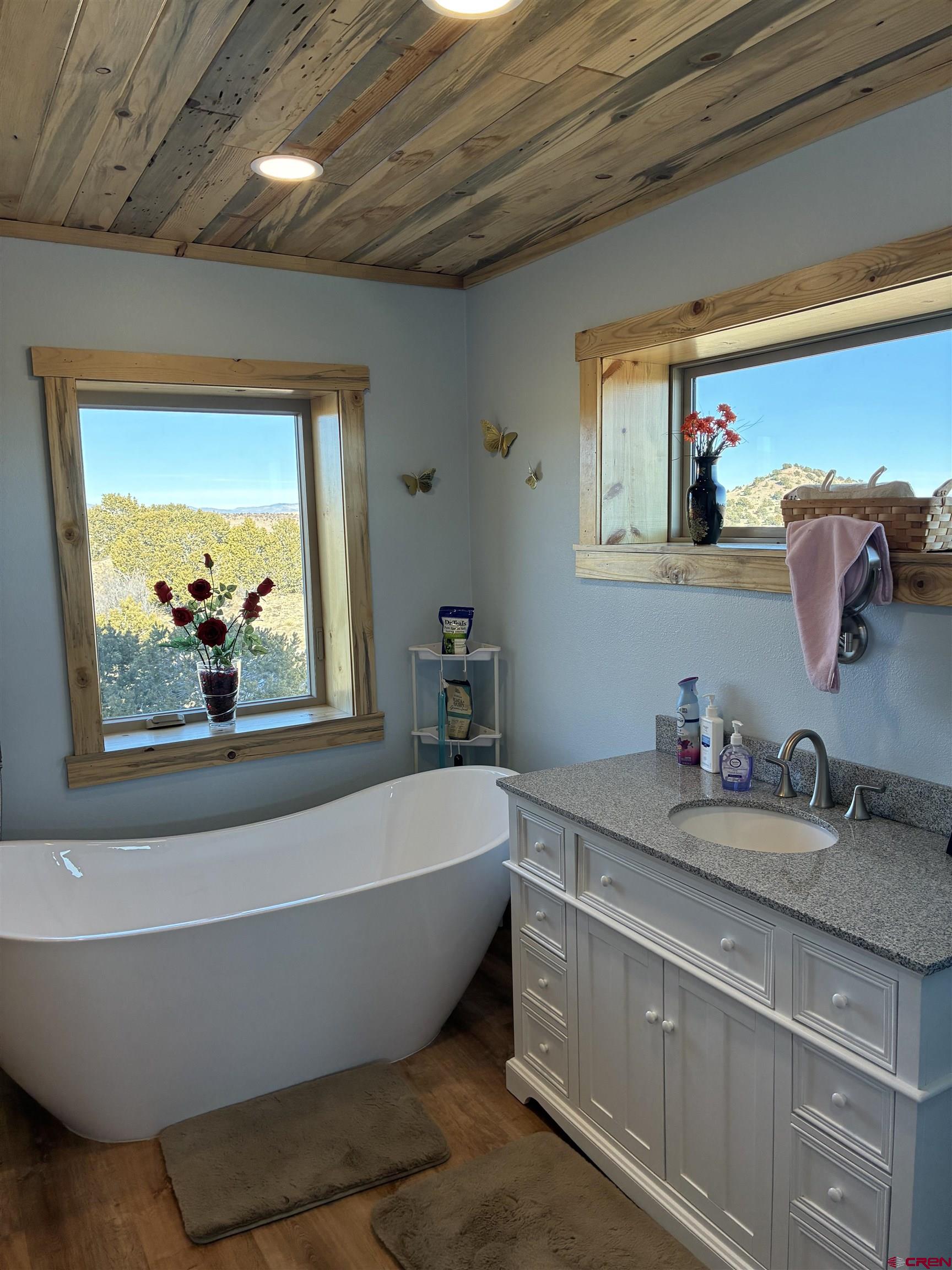 180 Boulder Lake Road Monte Vista, CO 81144 - Photo 14 of 35 a white bath tub sitting next to a bathroom sink