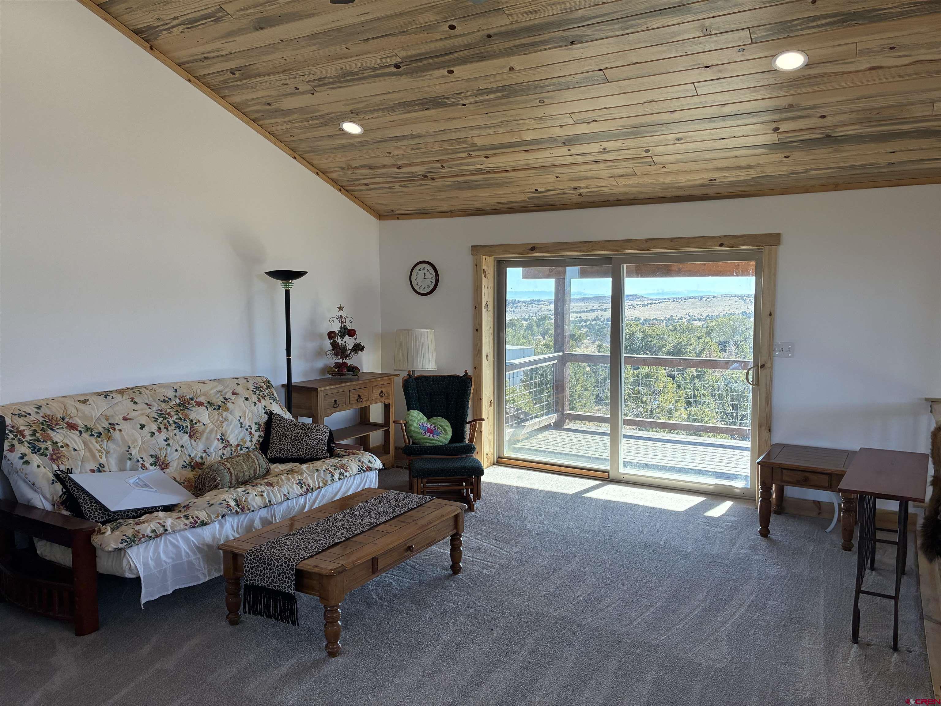 180 Boulder Lake Road Monte Vista, CO 81144 - Photo 16 of 35 a living room with furniture and a large window