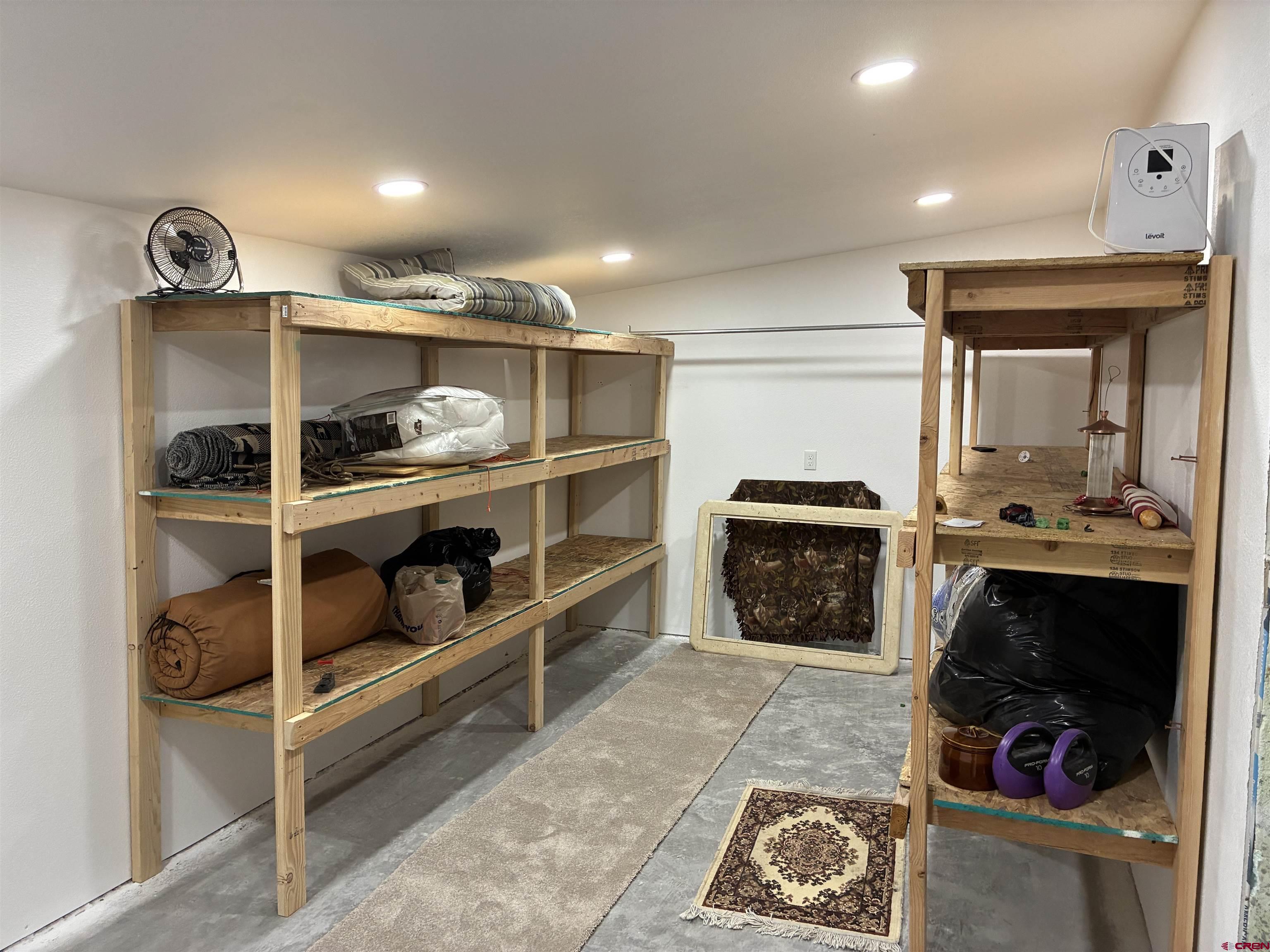 180 Boulder Lake Road Monte Vista, CO 81144 - Photo 22 of 35 a kitchen with a refrigerator and a stove