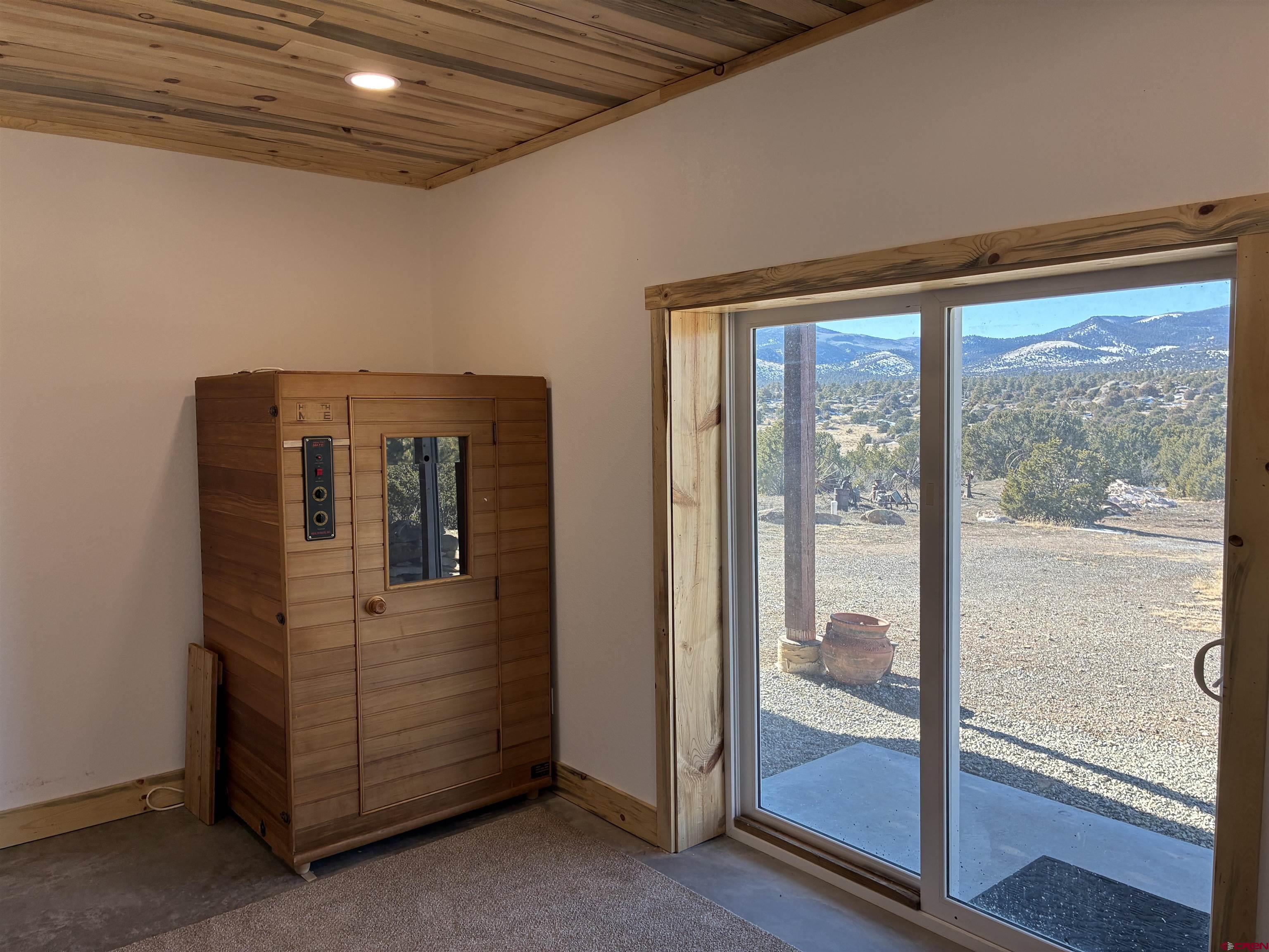 180 Boulder Lake Road Monte Vista, CO 81144 - Photo 23 of 35 a view of a hallway with a glass door
