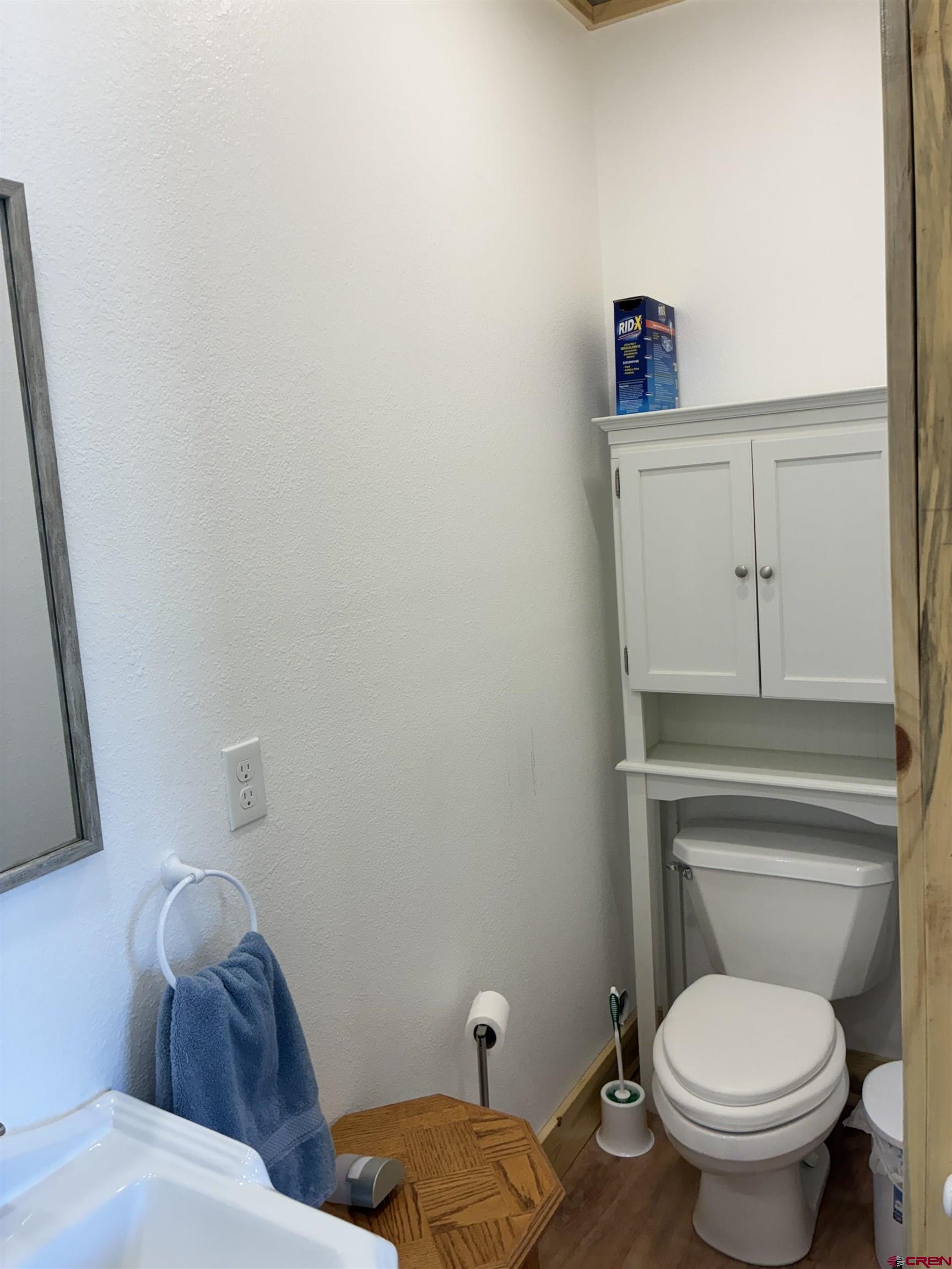 180 Boulder Lake Road Monte Vista, CO 81144 - Photo 25 of 35 a bathroom with a toilet and a sink