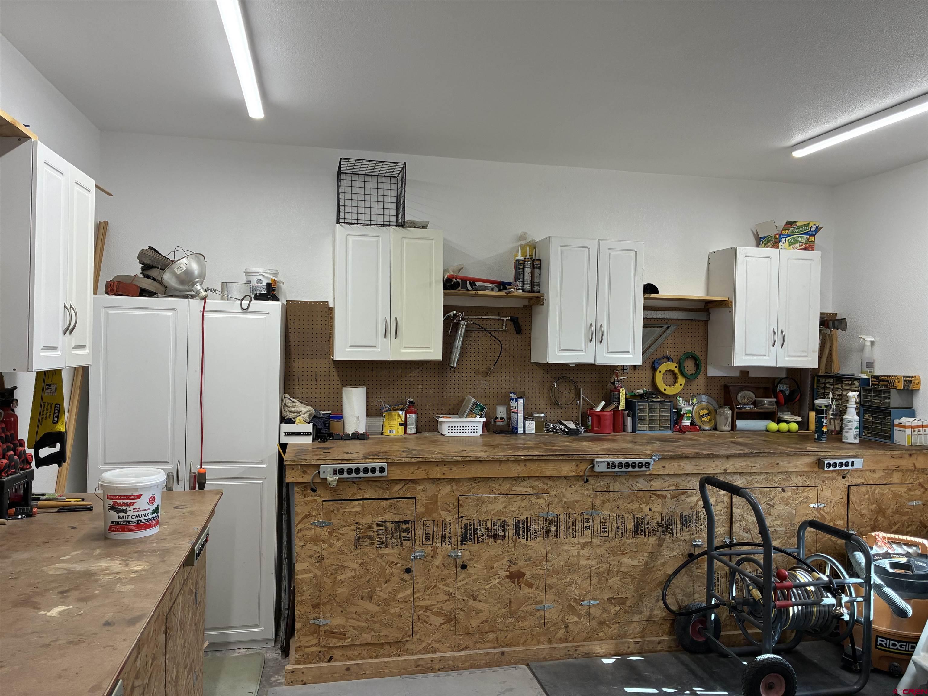 180 Boulder Lake Road Monte Vista, CO 81144 - Photo 27 of 35 a kitchen with stainless steel appliances granite countertop a sink refrigerator and cabinets