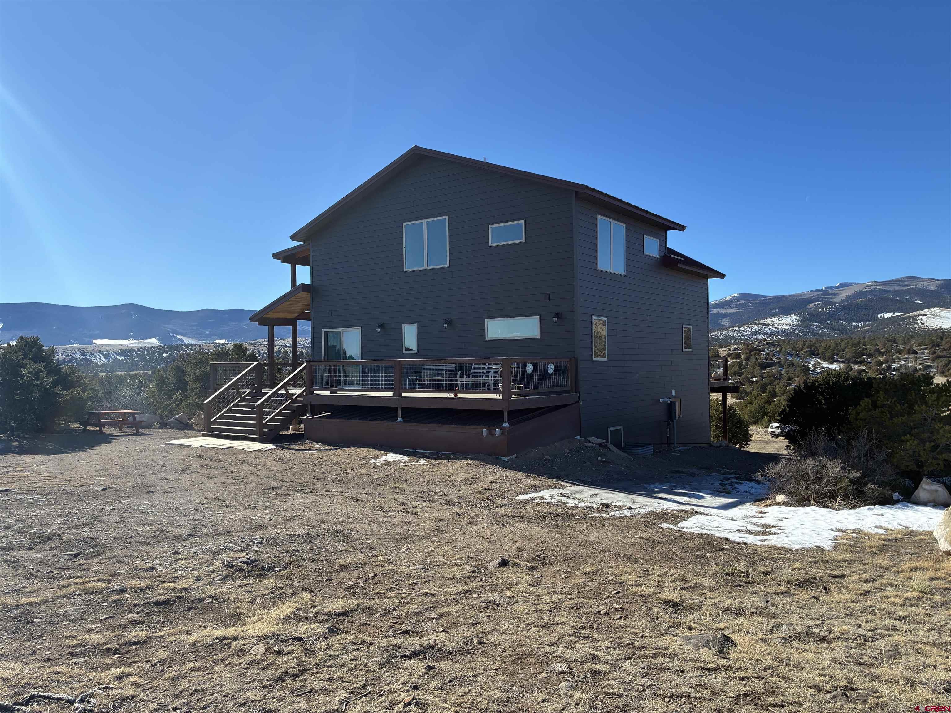 180 Boulder Lake Road Monte Vista, CO 81144 - Photo 3 of 35 a view of a house with a yard