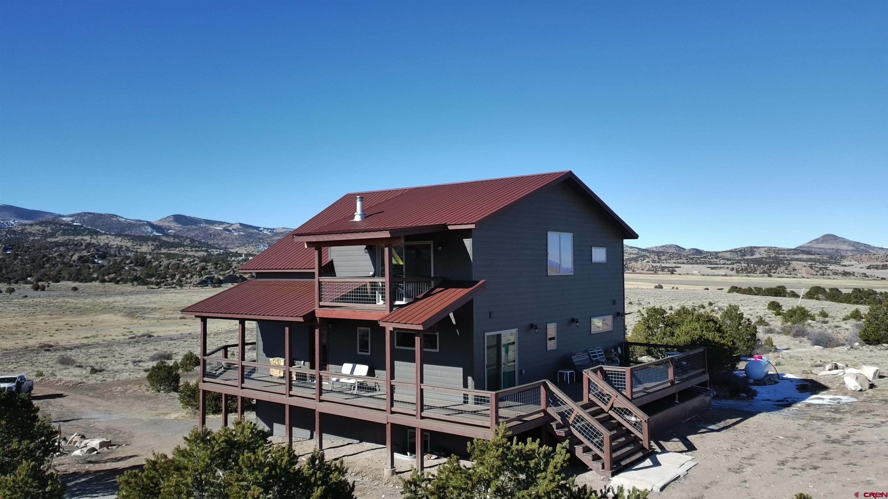 180 Boulder Lake Road Monte Vista, CO 81144 - Photo 33 of 35 a front view of a house with a yard